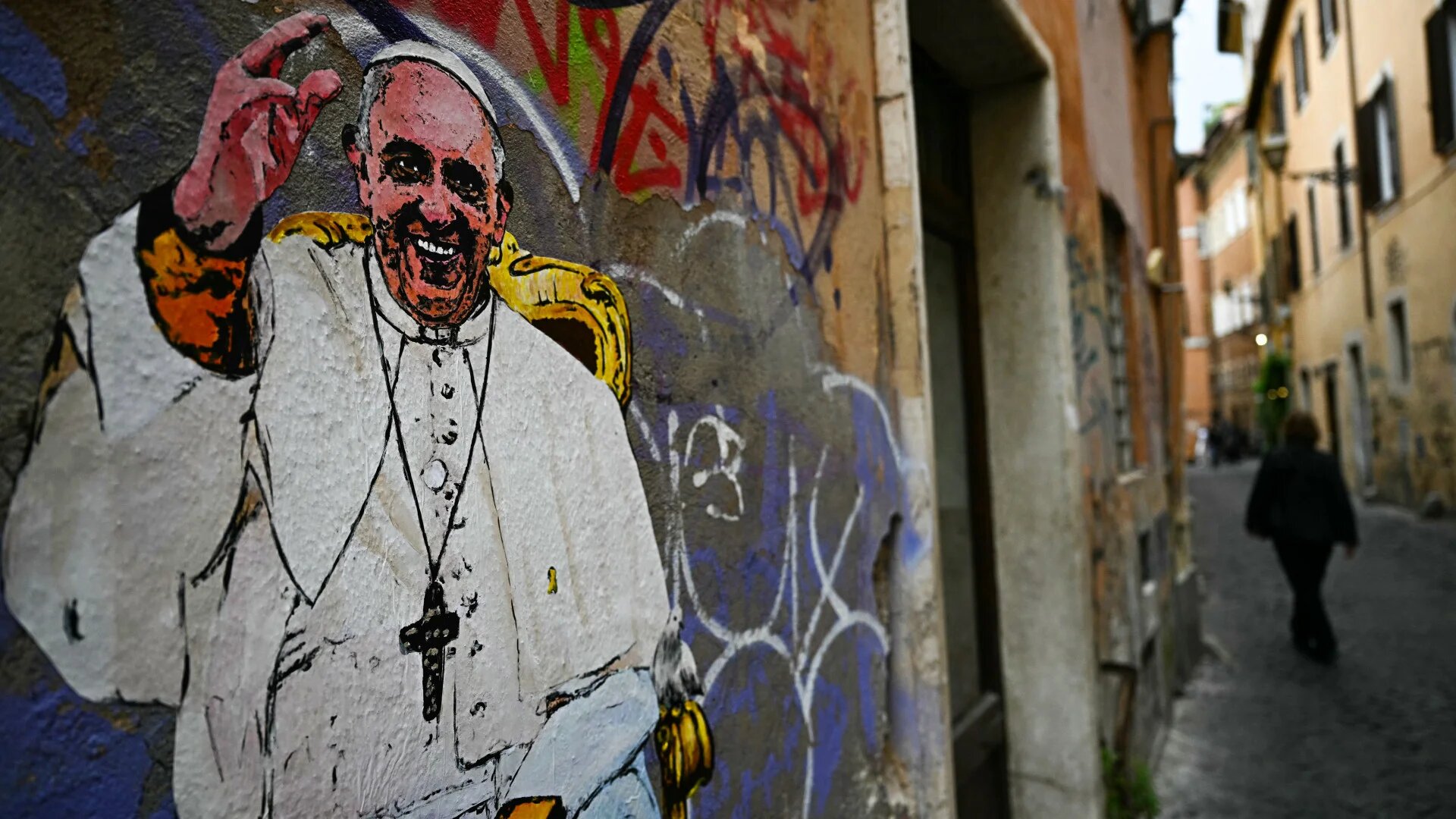 A portrait of Pope Francis by street artist Harry Greb is seen on a wall in Rome on 28 April 2025 (Gabriel Bouys/AFP)