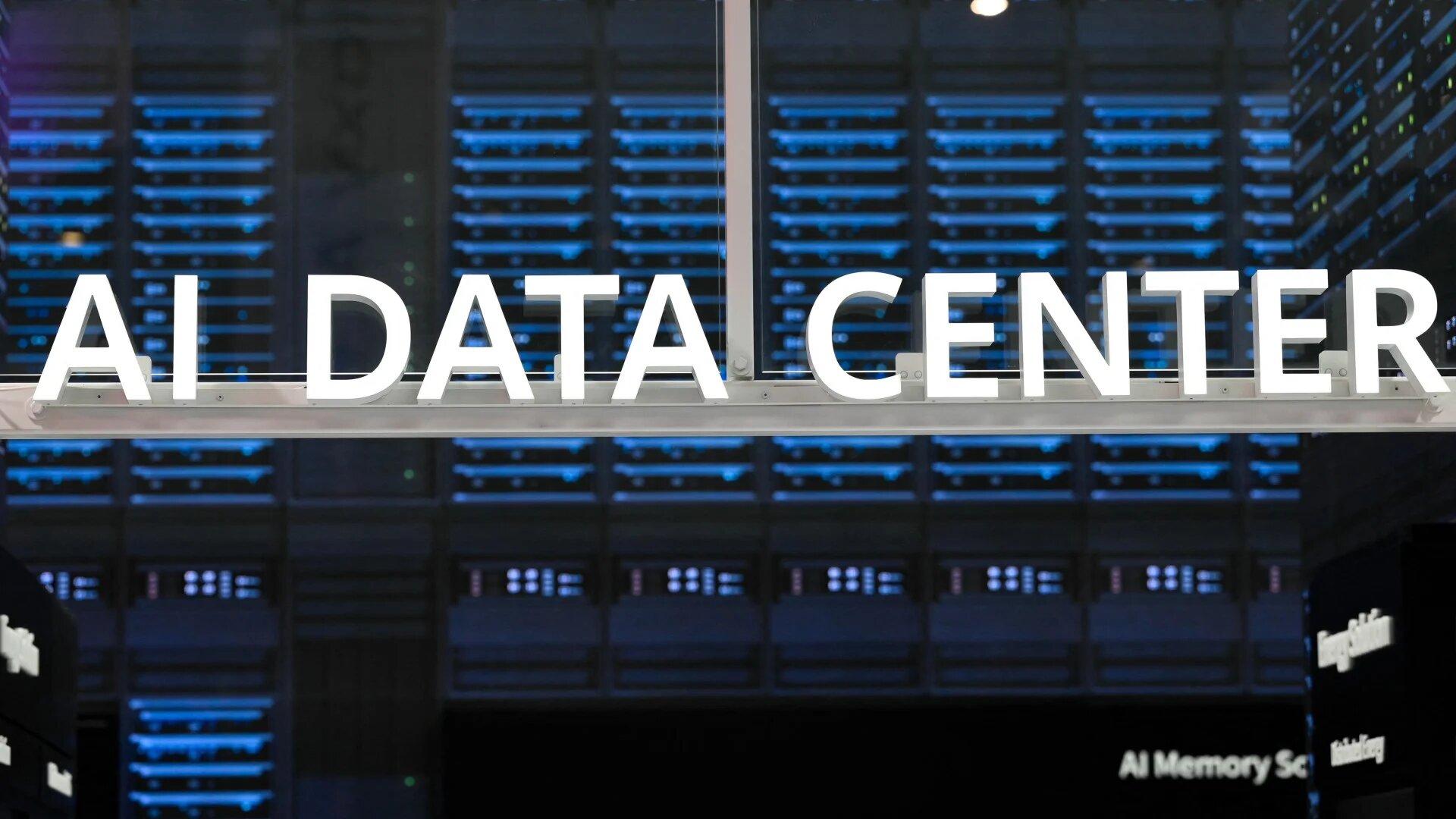 Signage of an AI data centre is displayed at the Mobile World Congress in Barcelona, 3 March 2025. US tech firms and China are turning to nuclear development to meet surging AI energy demands (Josep Lago/AFP)