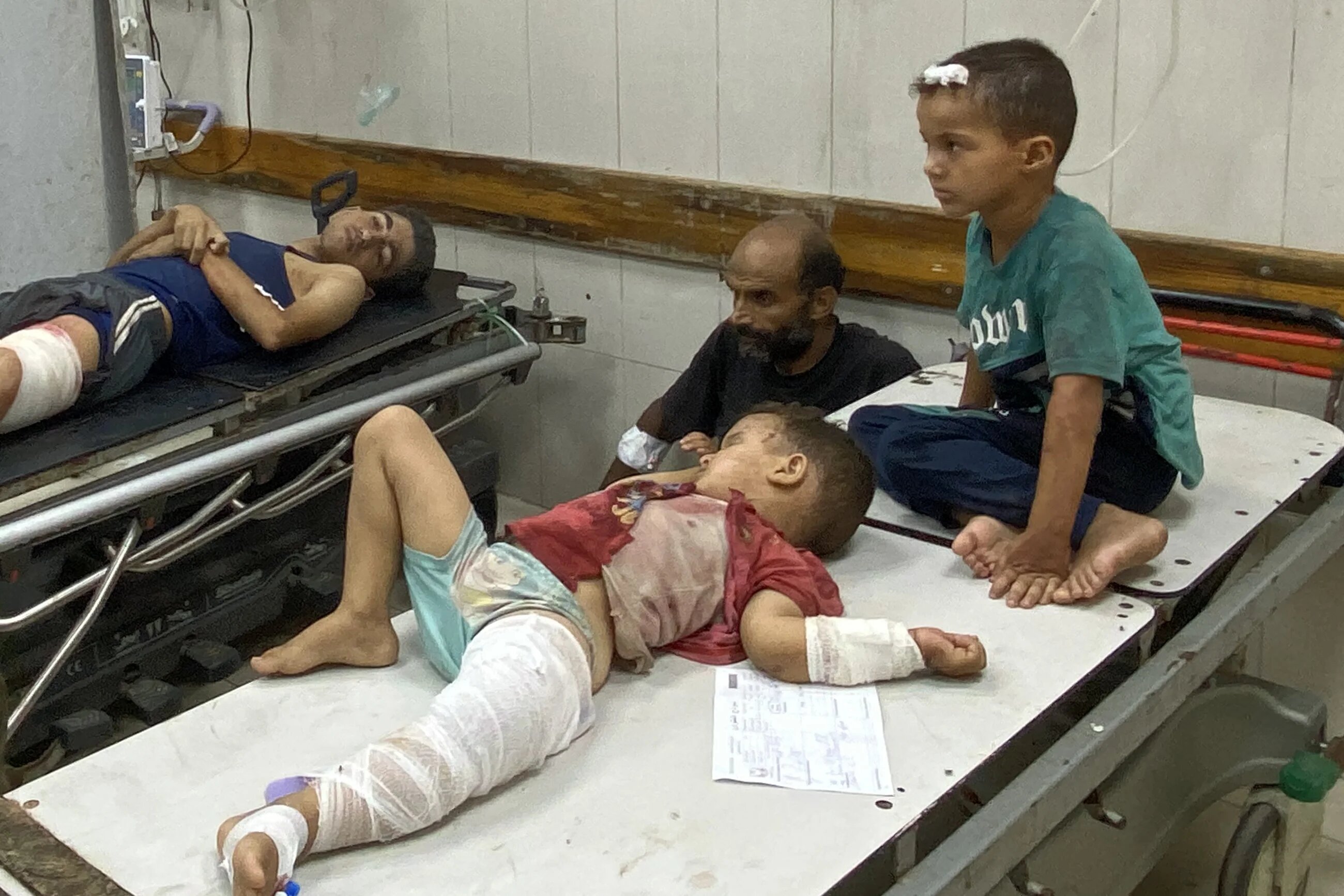 Injured children wait for treatment at Nasser Medical Complex in Khan Yunis in the southern Gaza Strip on July 28, 2025, following Israeli bombardment on the Mawasi area of Khan Yunis. (File/AFP)