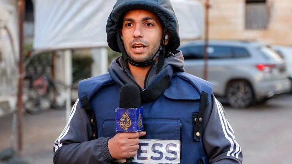 Slain Al Jazeera correspondent Anas al-Sharif photographed reporting in Gaza City on 31 December 2024 (AFP)