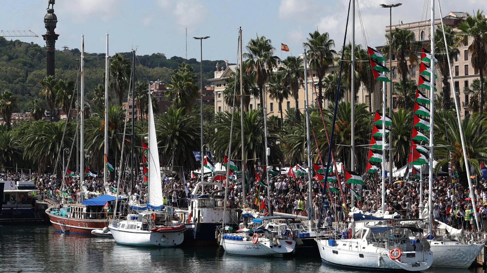 This photograph shows the boats of the flotilla aimed at breaking the Israeli blockade of the Gaza Strip, moored at the port of Barcelona, on 31 August 2025 (AFP/Lluis Gene)