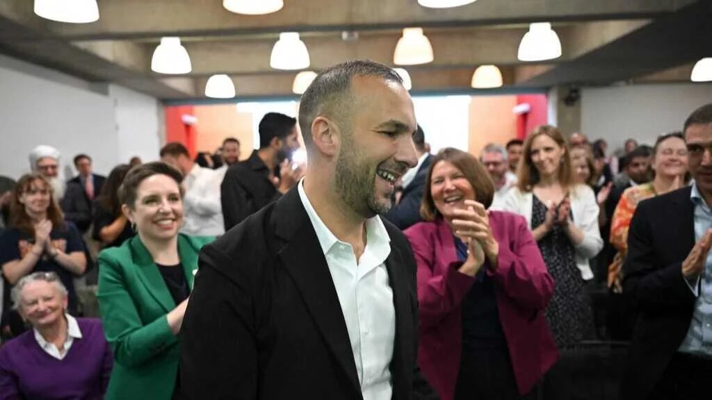 Britain's newly announced leader of the Green Party, Zack Polanski, reacts on hearing the announcement of the results of an internal leadership election, at a media event in central London on 2 September