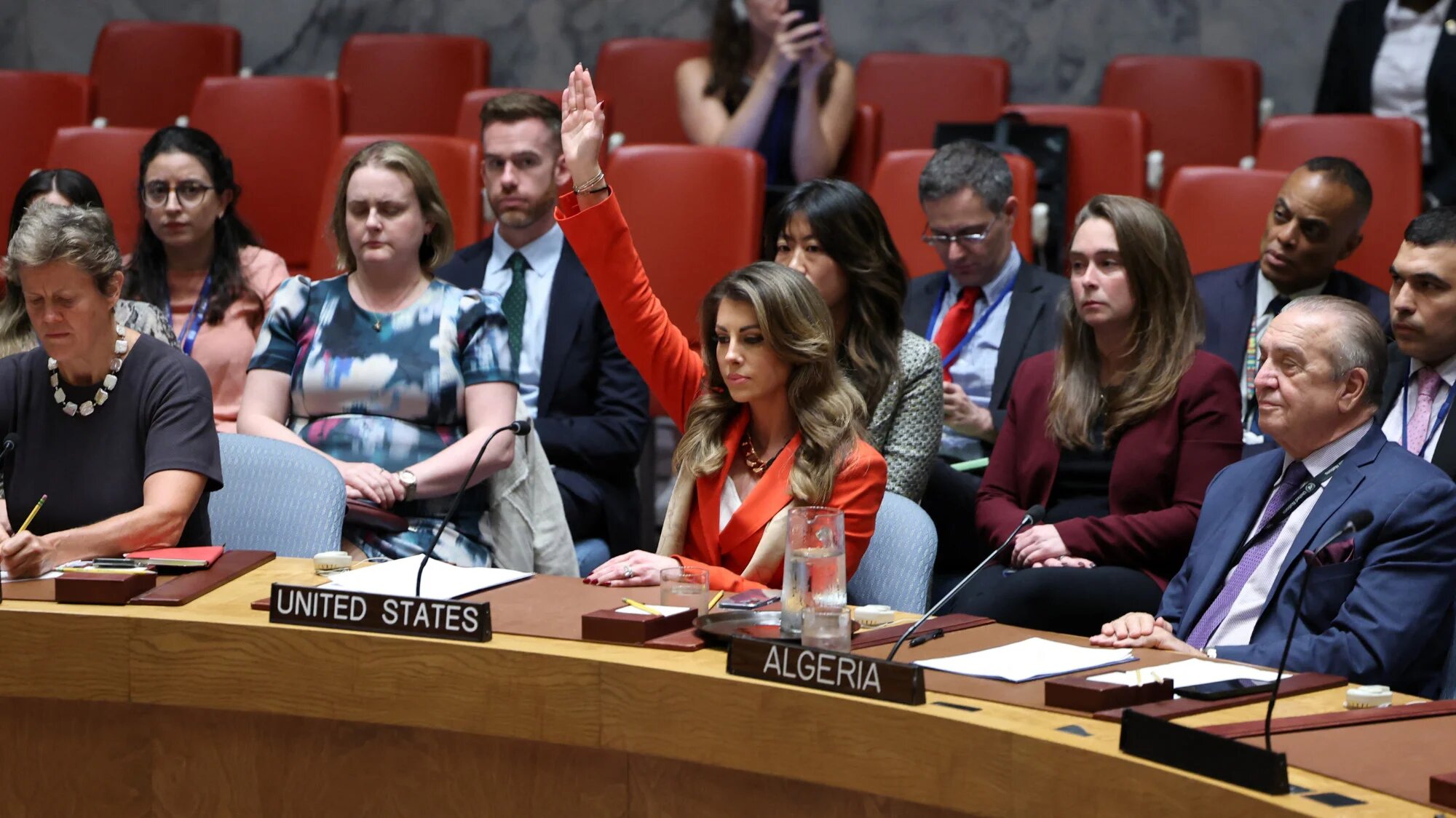 US deputy Middle East envoy Morgan Ortagus (C) raises her hand to veto a draft resolution during a United Nations Security Council meeting on the situation in Gaza, at UN headquarters in New York on 18 September 2025 (AFP/Angela Weiss)