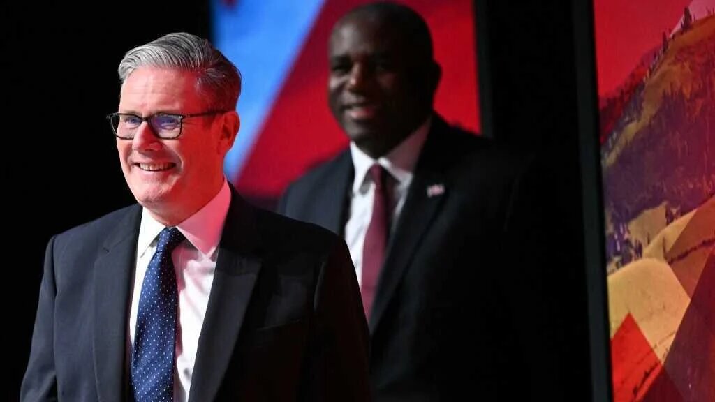 Britain's Prime Minister Keir Starmer (L) and Britain's Justice Secretary and deputy Prime Minister David Lammy attend the first day of the annual Labour Party conference in Liverpool, north-west England, on September 28,
