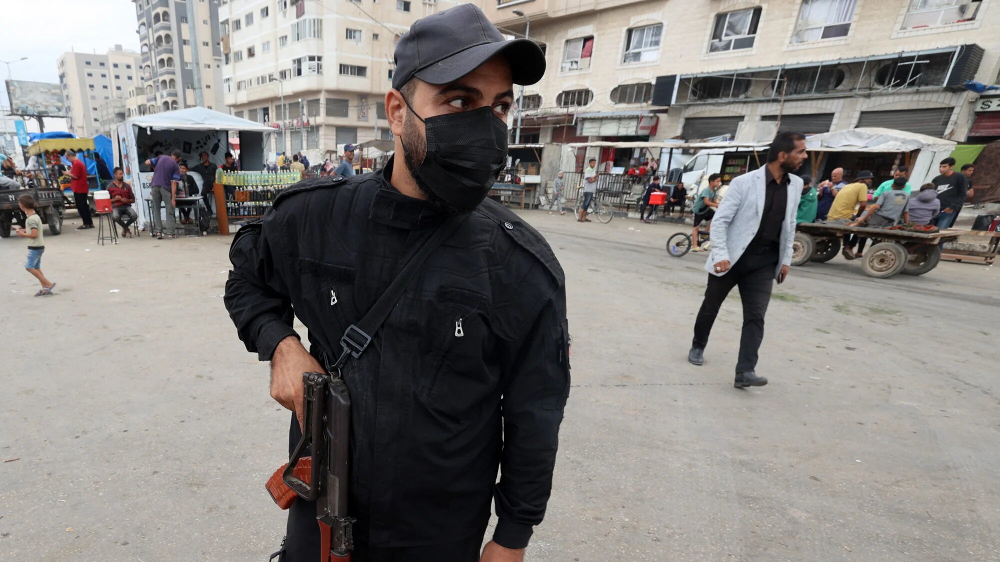 A member of the internal security forces loyal to the Palestinian group Hamas, mans a checkpoint in the Nuseirat refugee camp in the central Gaza Strip, on 12 October 2025 (AFP/Eyad Baba)