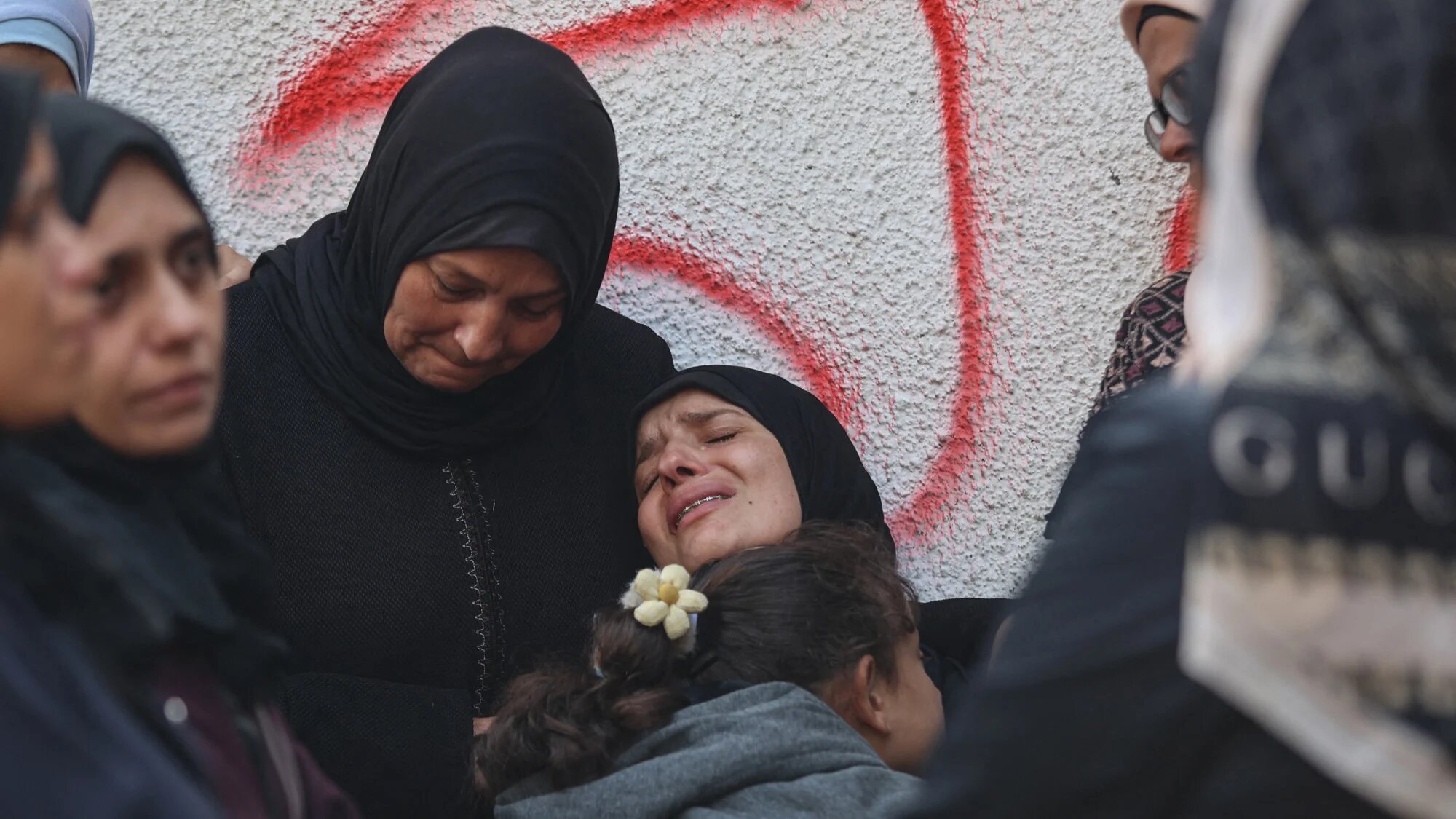 Palestinians mourn the death of loved ones killed in overnight Israeli strikes at the Al-Shifa Hospital in Gaza City on 29 October 2025 (AFP/Omar al-Qattaa)