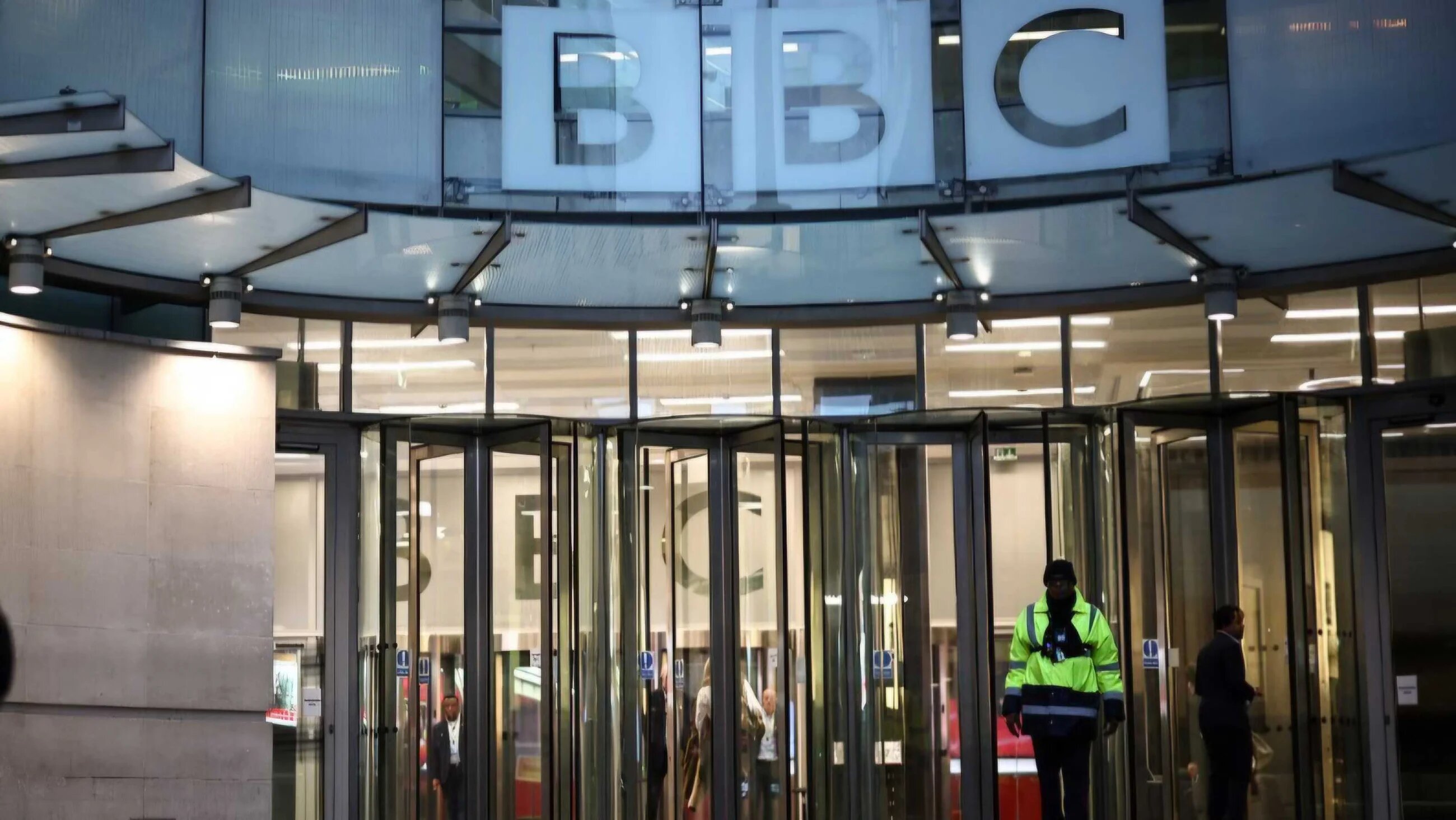 A man walks by the entrance to the BBC in London on November 10, 2025.