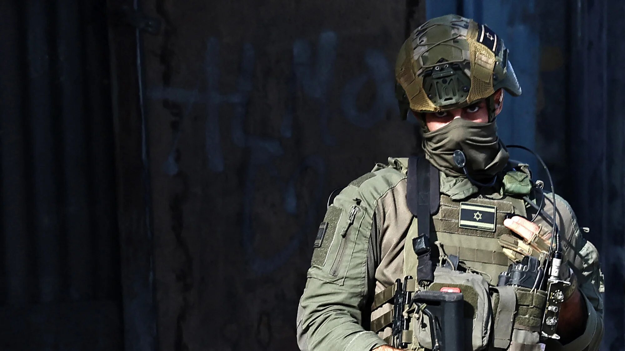 Israeli soldier takes position during a raid in Nablus, West Bank, on 20 November 2025 (AFP/Zain Jaafar)