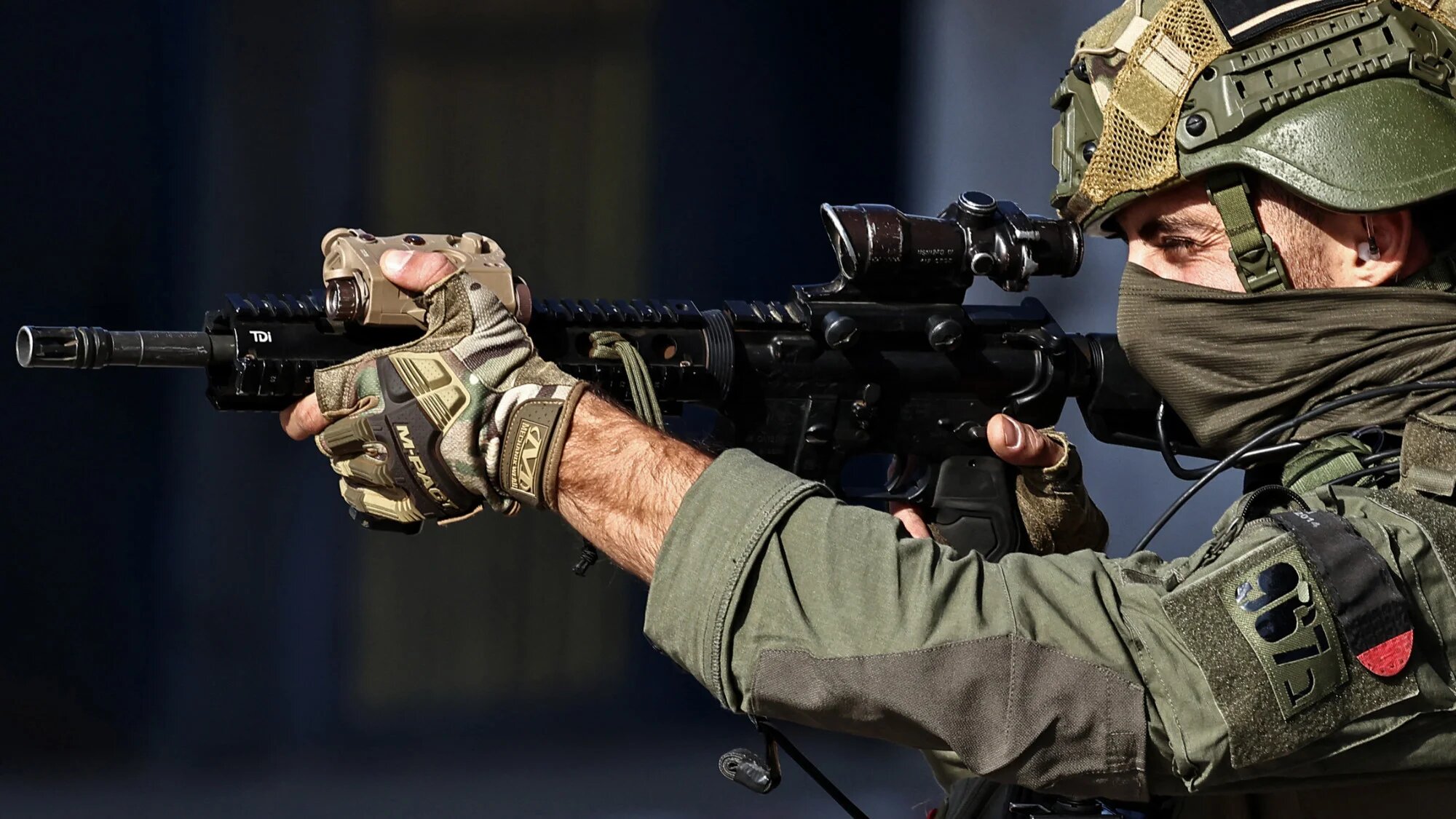 An Israeli trooper takes his position along a street during a raid in Nablus city, in the occupied West Bank on 20 November 2025 (AFP/Zain Jaafar)