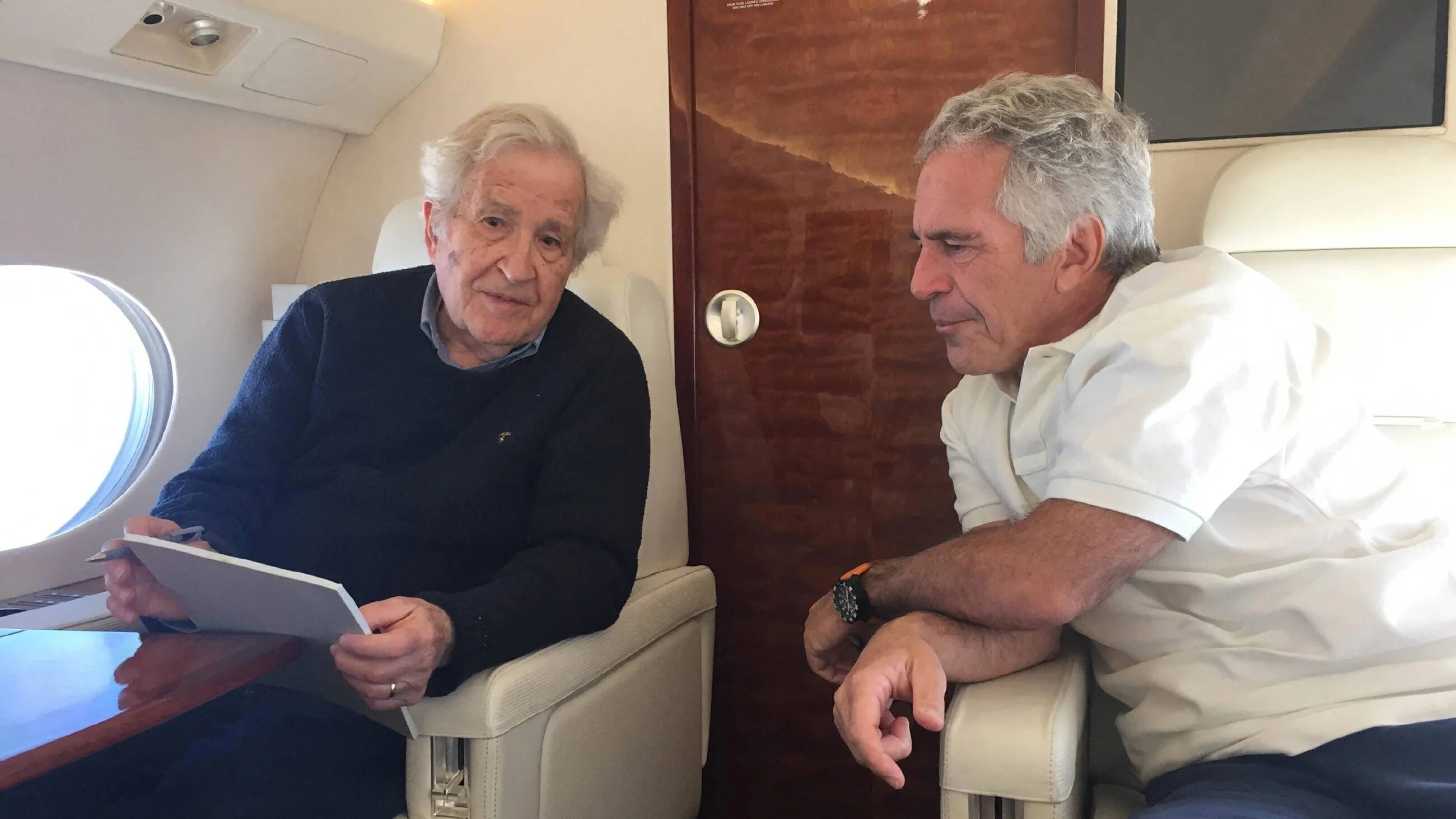 Jeffrey Epstein (right) is seen speaking with US professor and political activist Noam Chomsky (AFP)