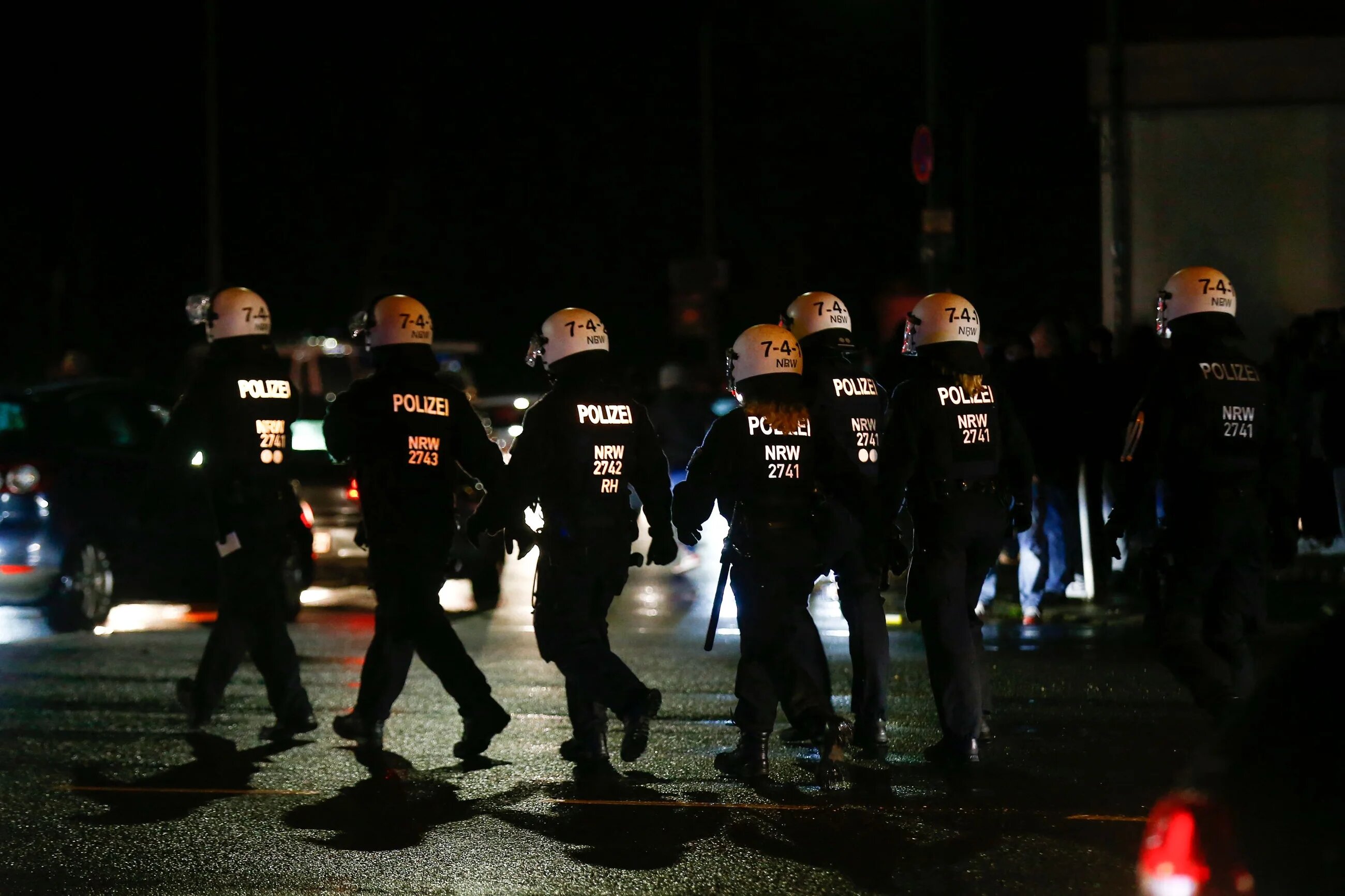 Police move in on Essen fans celebrating with flares after the German Cup (DFB Pokal) last 16 football match Rot-Weiss Essen v Bayer Leverkusen in Essen, western Germany on February 2, 2021 (AFP)