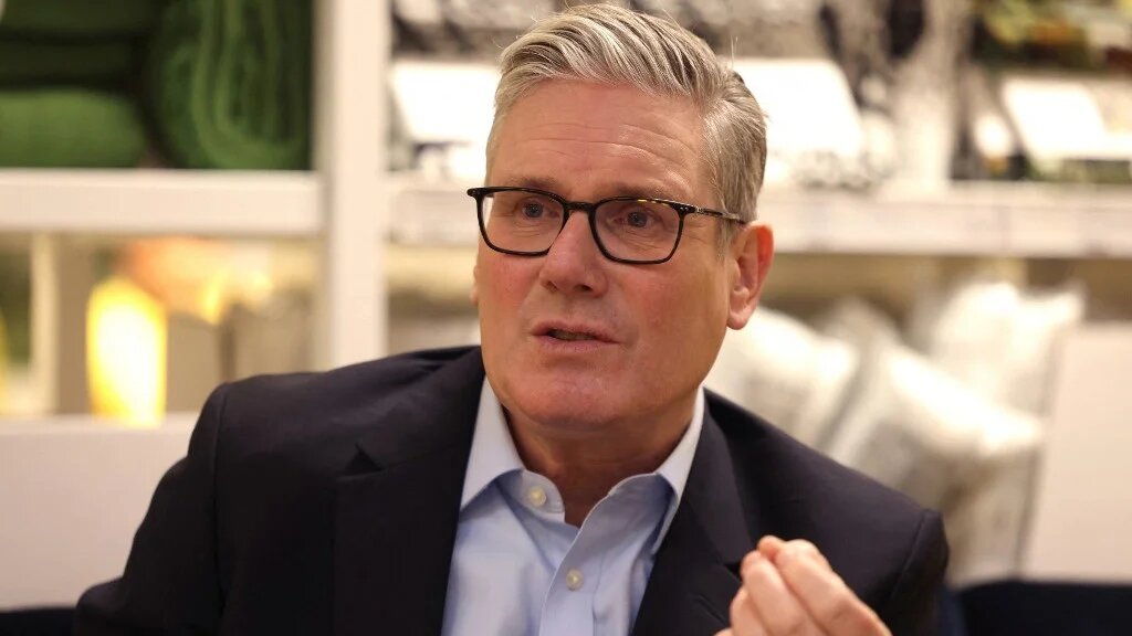 Britain's Prime Minister Keir Starmer speaks with members of staff during a visit to a branch of Swedish furniture store Ikea in Croydon, south London on January 12, 2026.