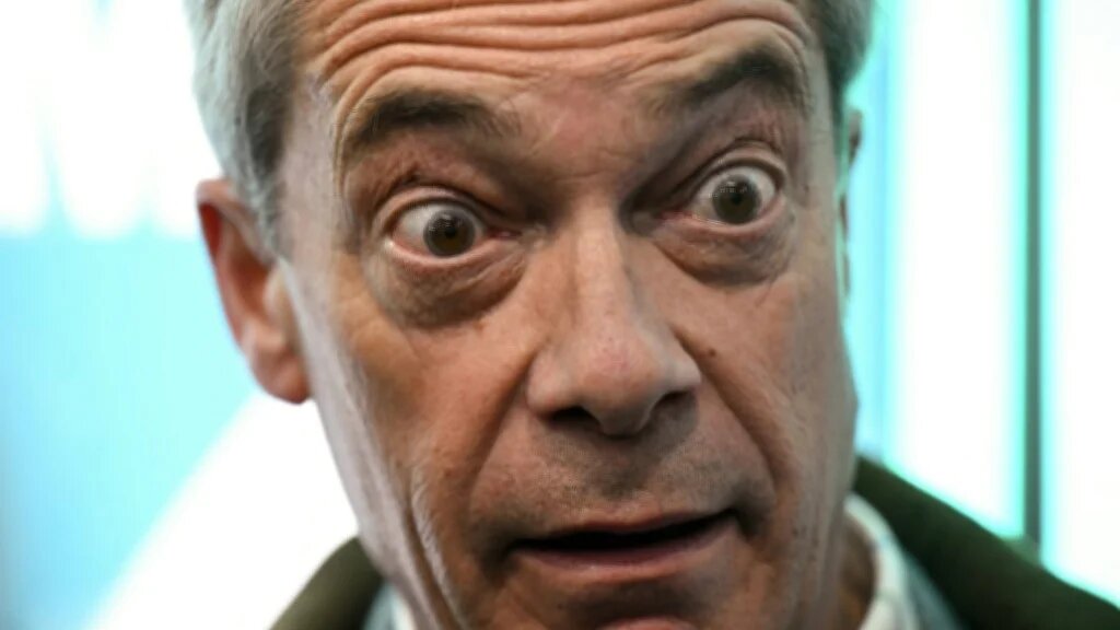  Reform UK leader Nigel Farage reacts as he visits the Gorton and Denton Reform UK campaign office, northwest England on February 5, 2026, ahead of the February 26 Gorton and Denton by-election. 