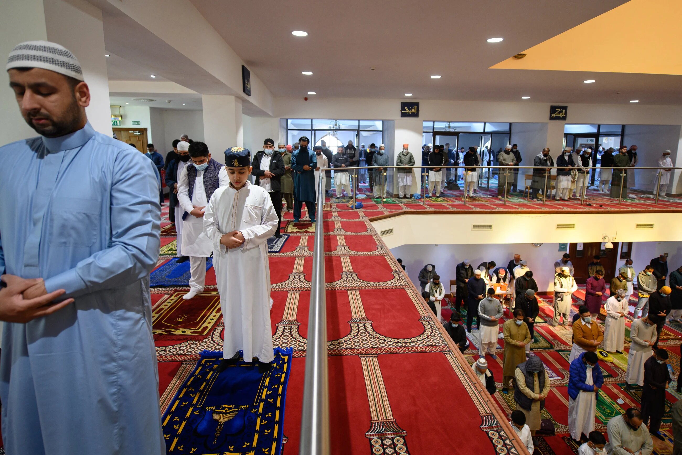 Muslims gather to perform the Eid al-Fitr prayer, which marks the end of the holy month of Ramadan, at Bradford Central Mosque, northern England, on 13 May 2021 (AFP)