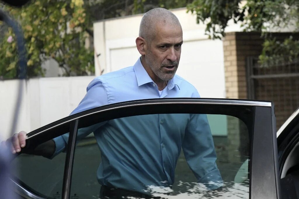 Ronen Bar, chief of the Israel Security Agency, also known as "Shin Bet", enters a vehicle at an undisclosed location in central Israel on 11 October 2021 (AFP)