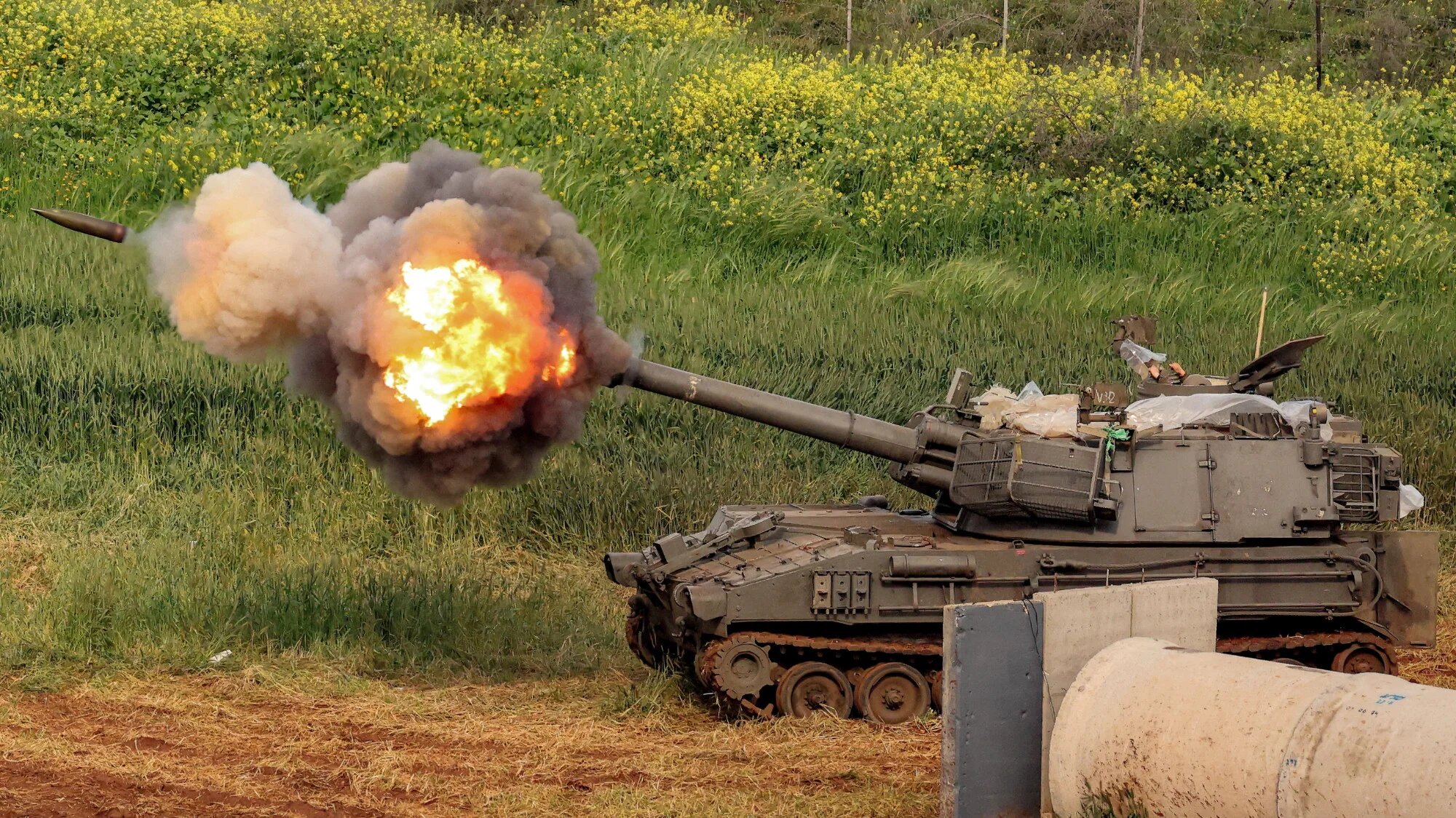 An Israeli self-propelled howitzer artillery gun fires rounds towards southern Lebanon from a position in the upper Galilee in northern Israel on 26 March 2026 (AFP/Jack Guez)
