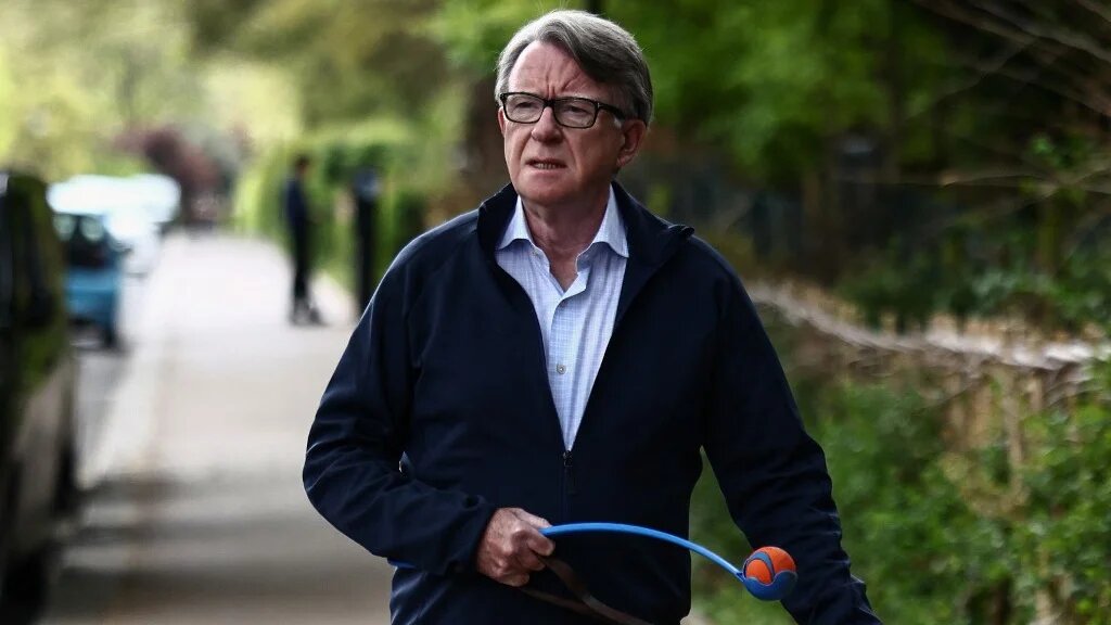Former UK ambassador to the United States, Peter Mandelson, walks his dog near his residence in central London on April 20, 2026.