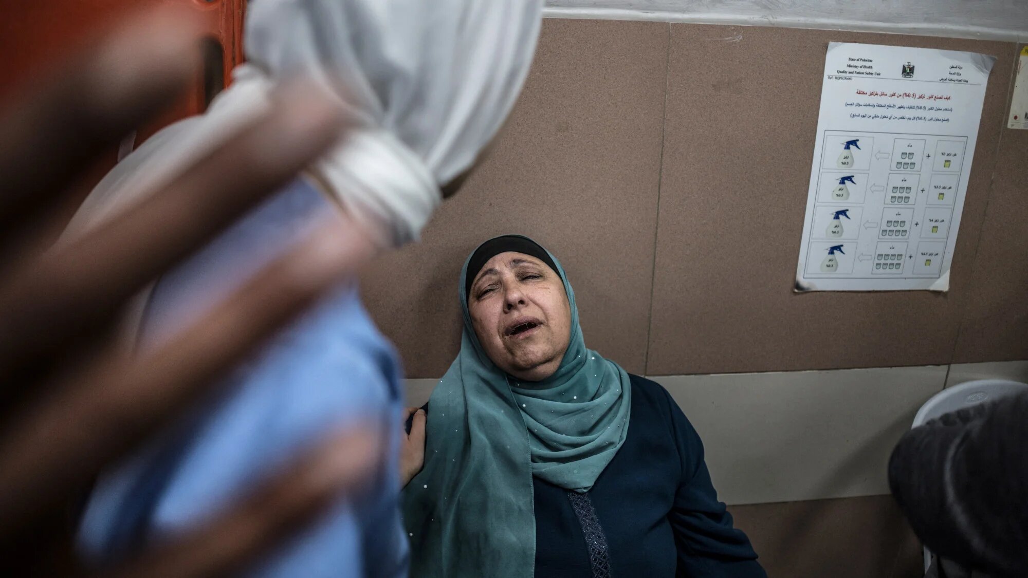 Mother of a Palestinian killed by an Israeli settler in the village of al-Mughayyir, east of Ramallah in the occupied West Bank, mourn at a hospital in Ramallah on 21  April 2026 (AFP/Marco Longari)