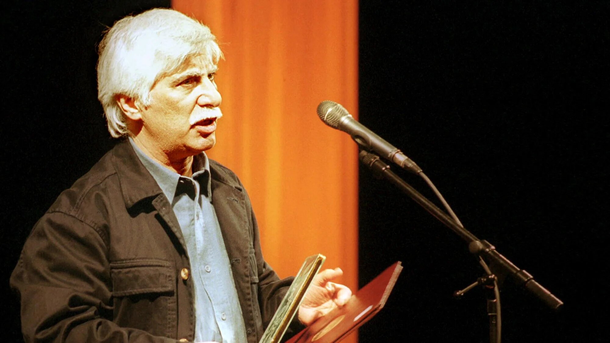 Iranian filmmaker Bahram Beizai speaks after receiving two awards for his film 'The Dog Massacre' at the closing ceremony of the 19th Fajr International Film Festival in Tehran on 9 February 2001 (Behrouz Mehri/AFP)