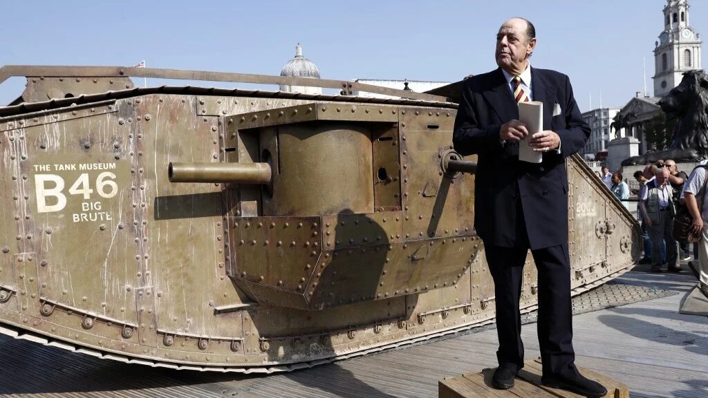 Sir Nicholas Soames, grandson of war-time prime minister Winston Churchill, gives an impromptu speech beside a British Mark IV tank in Trafalgar Square in central London, on September 15, 2016