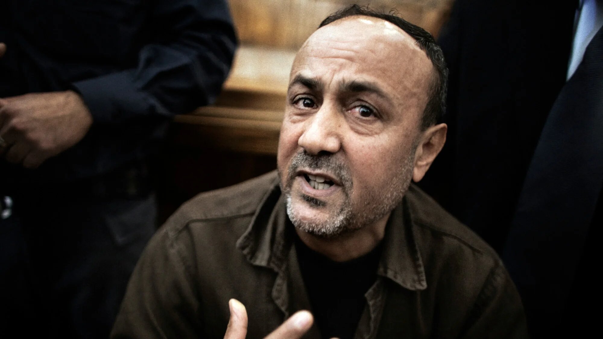 Palestinian Fatah leader Marwan Barghuti gestures inside Jerusalem's Magistrate Court on 25 January 2012 (AFP/Marco Longari)