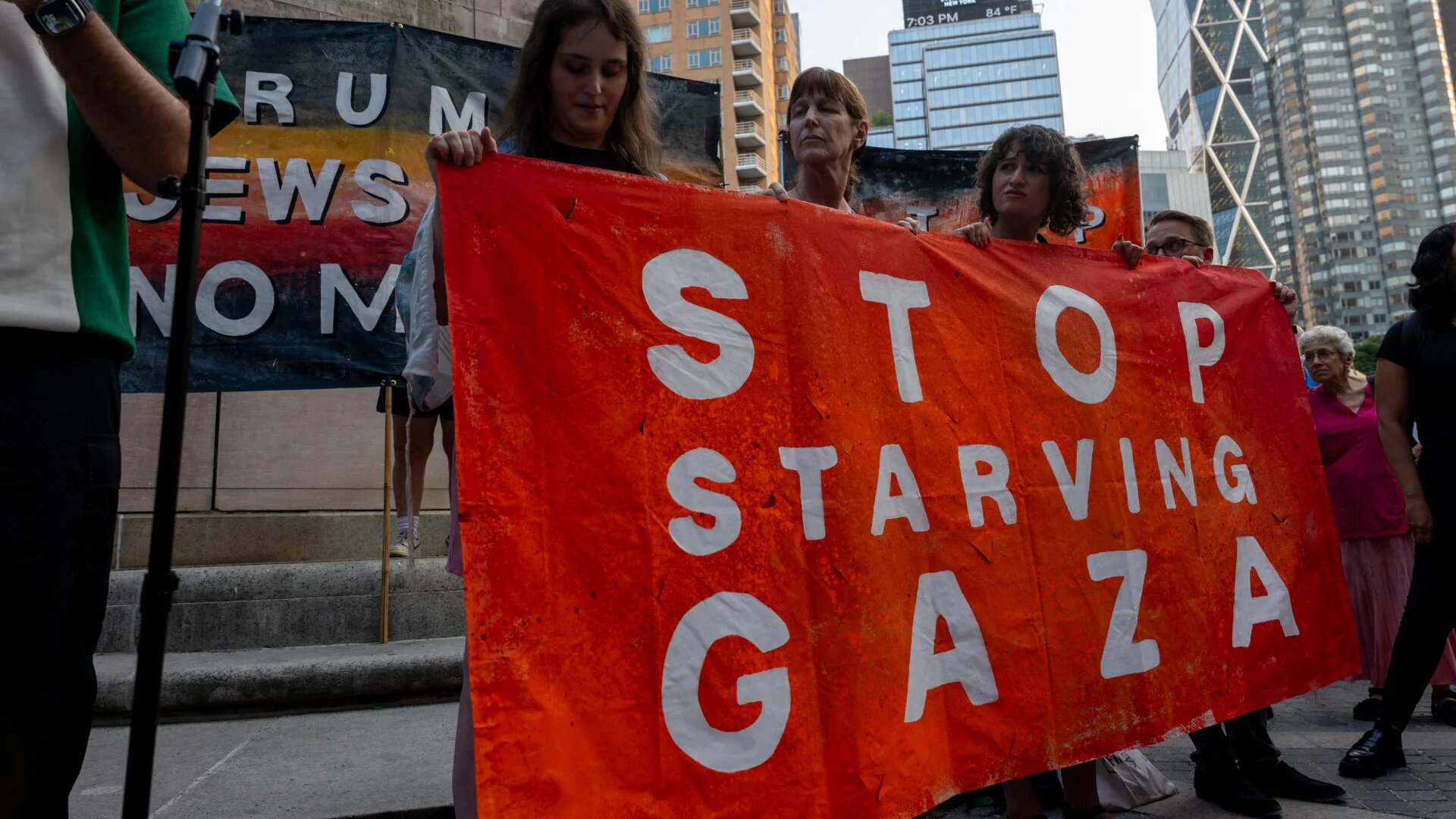 Jewish peace activists gather near the Trump Hotel at Columbus Circle in New York City on 4 August to protest Israel's war on Gaza and the blockade-induced famine, which has killed thousands (Spencer Platt/Getty Images via AFP)