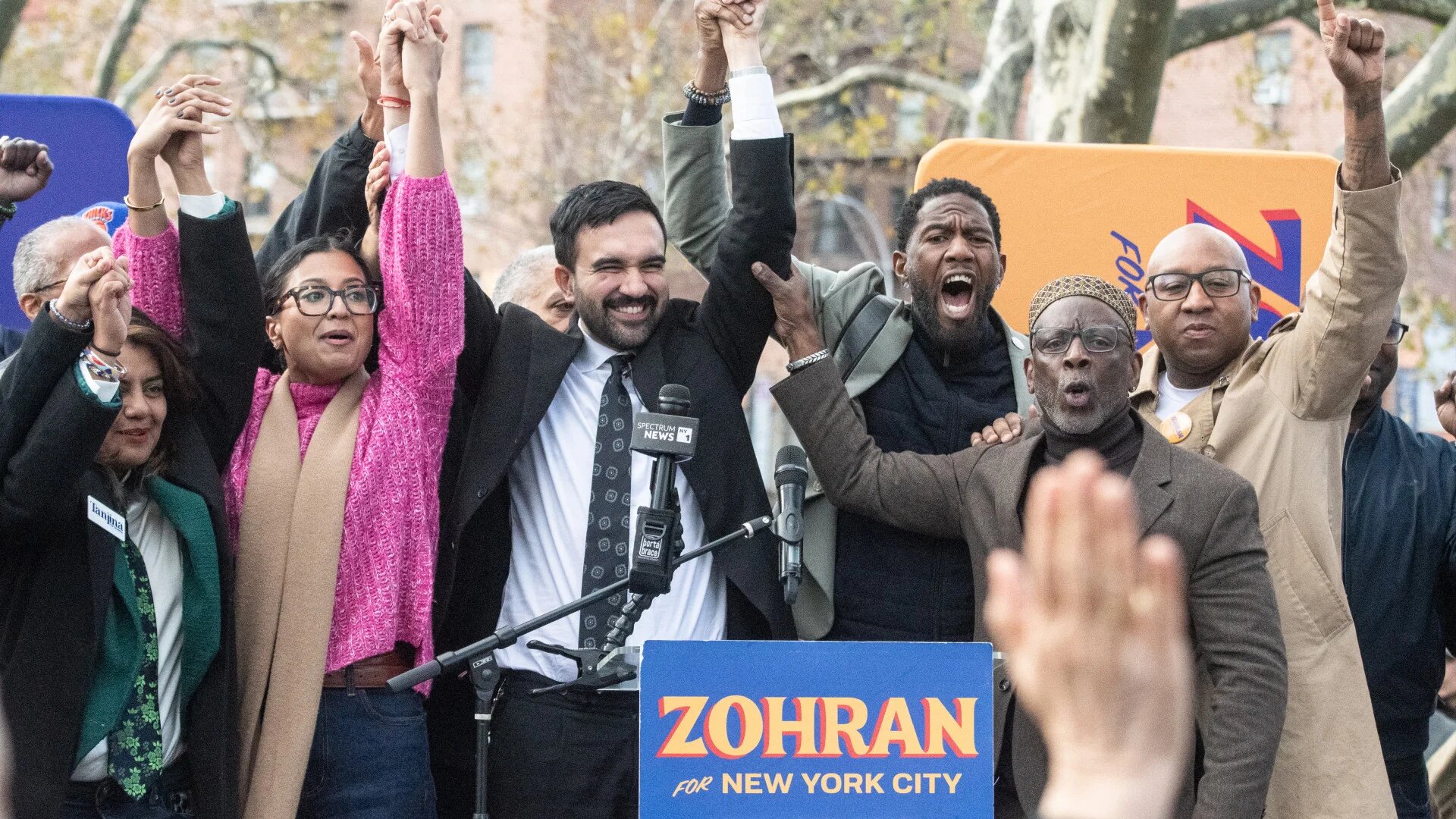 Zohran Mamdani, Democratic candidate for New York City mayor, holds hands with supporters during a campaign event in Queens on 1 November 2025, days before the election (Stephanie Keith/Getty Images/AFP)