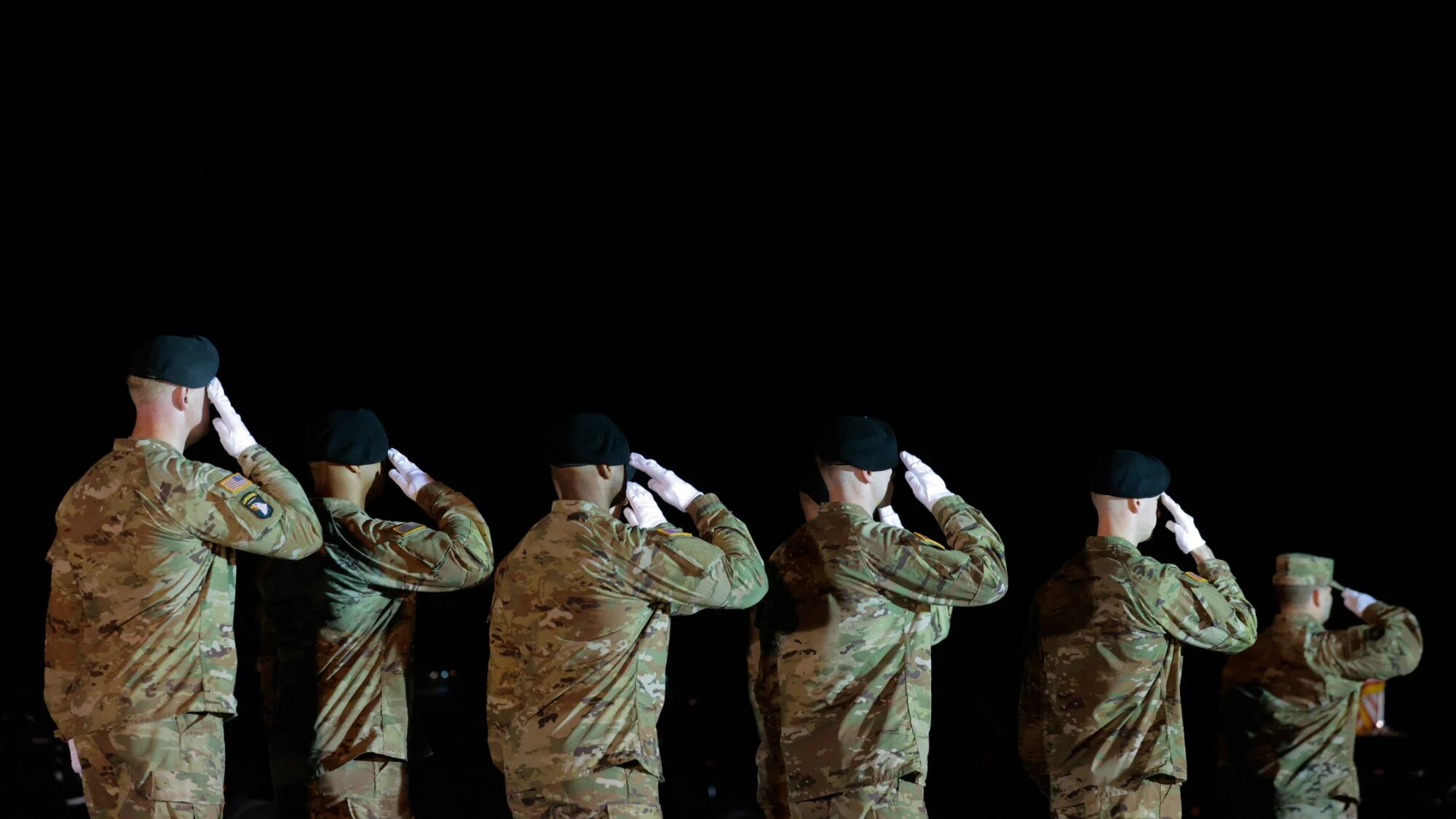 A US Army carry team salutes the remains of Army Sergeant Benjamin N Pennington at Dover Air Force Base in Dover, Delaware, 9 March 2026 (Chip Somodevilla/Getty Images via AFP)