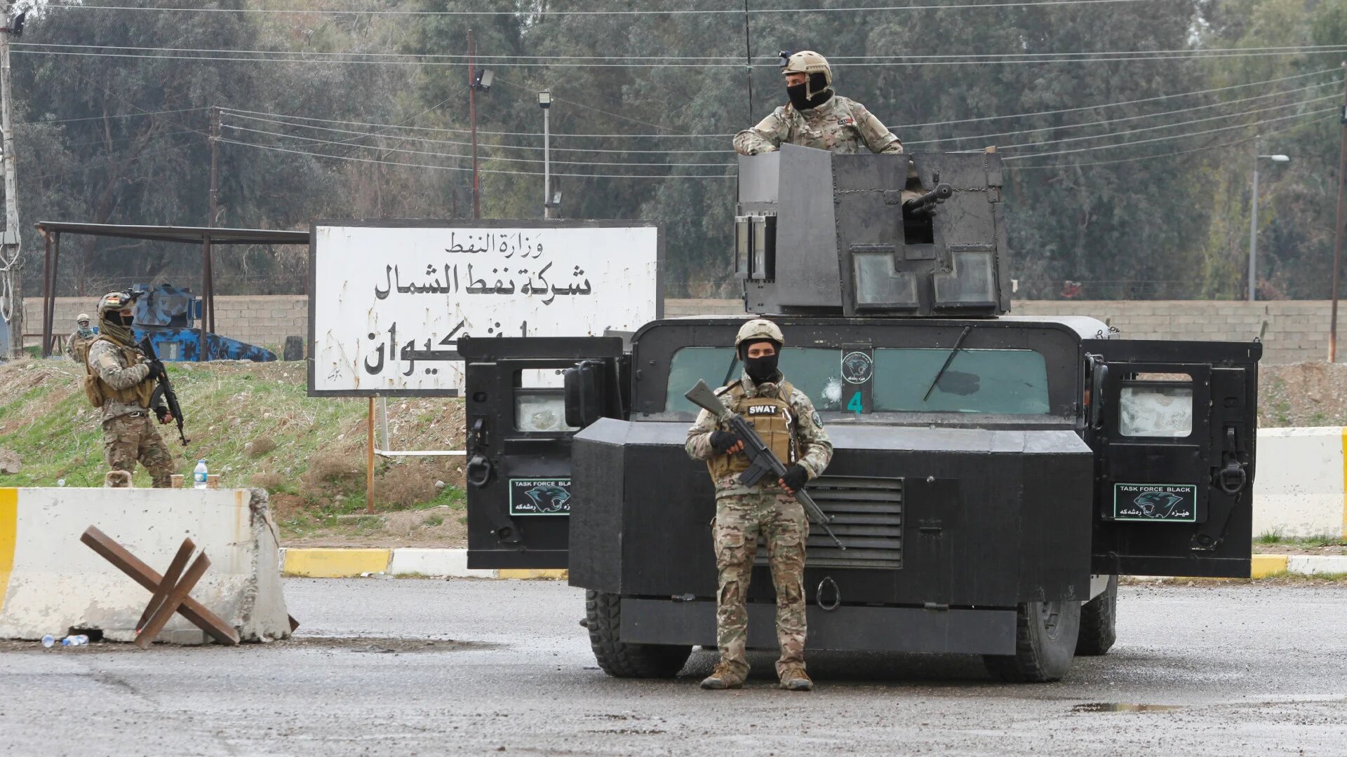 Kurdish forces loyal to the Patriotic Union of Kurdistan (PUK) party are seen after storming a facility in protest at the Iraqi government's oil policy in Kirkuk, Iraq, on 2 March 2017 (Reuters)