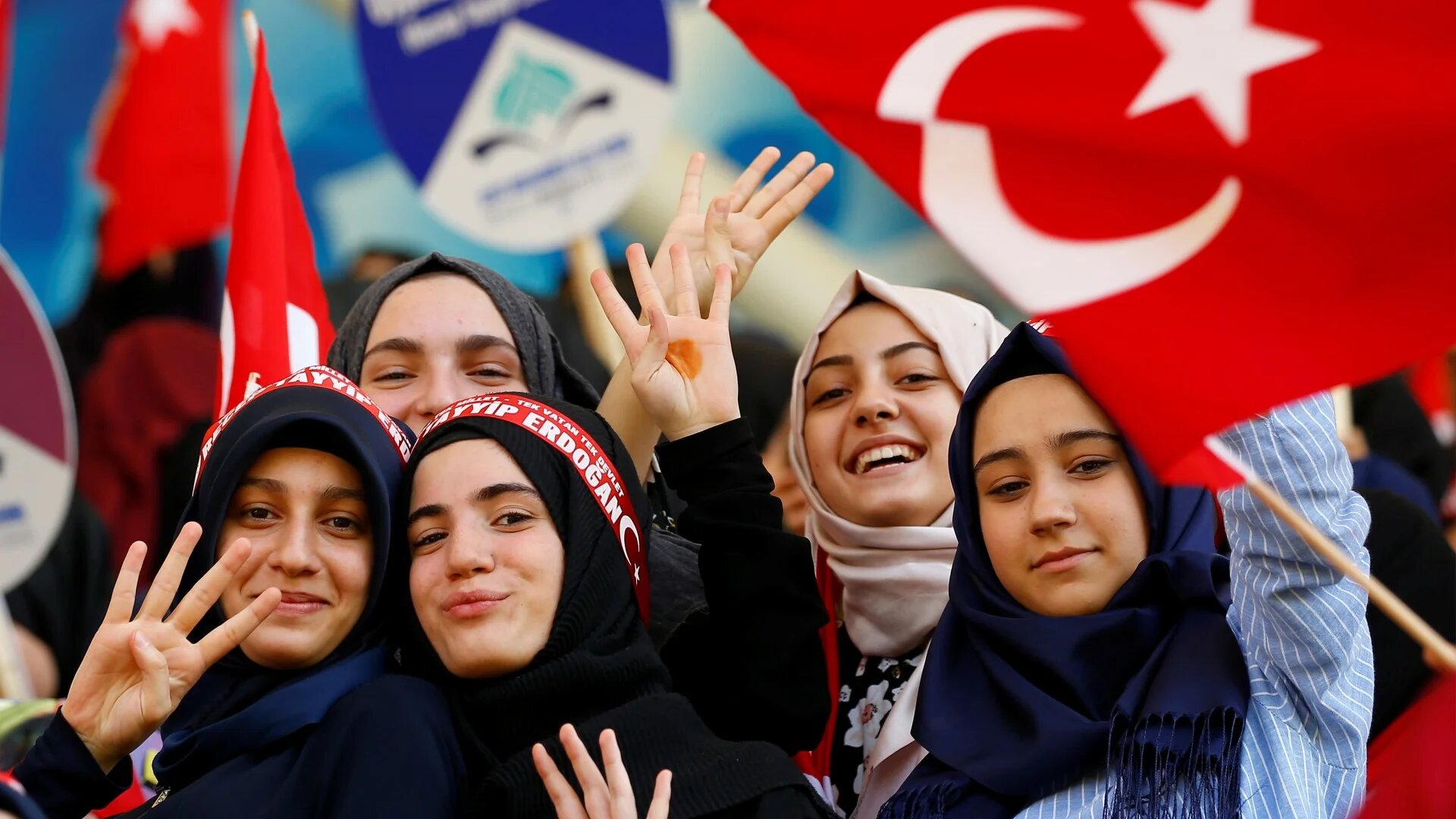 Imam Hatip school students wave national flags during a graduation ceremony in Istanbul in 2017 (Reuters)
