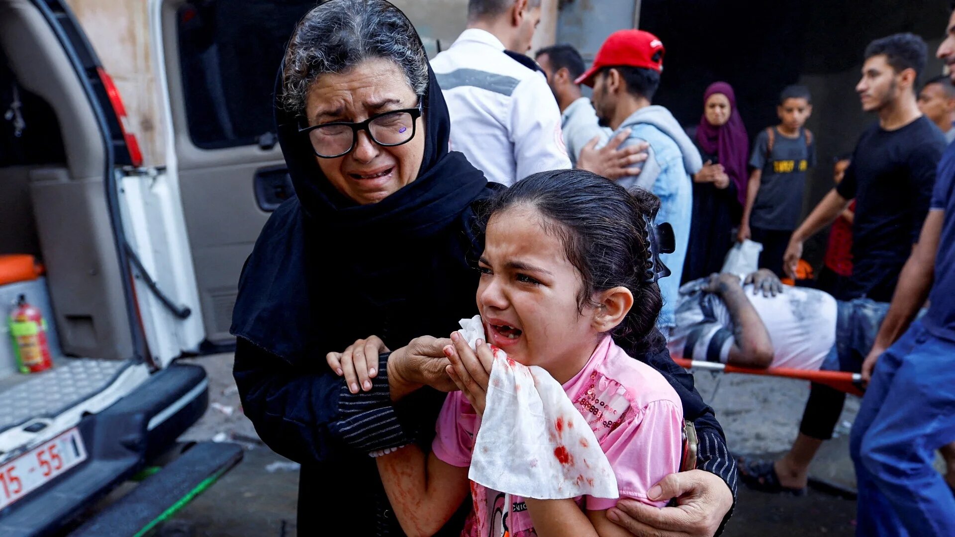A Palestinian girl reacts in the aftermath of Israeli strikes, in Khan Younis in the southern Gaza Strip, 14 October (Reuters)