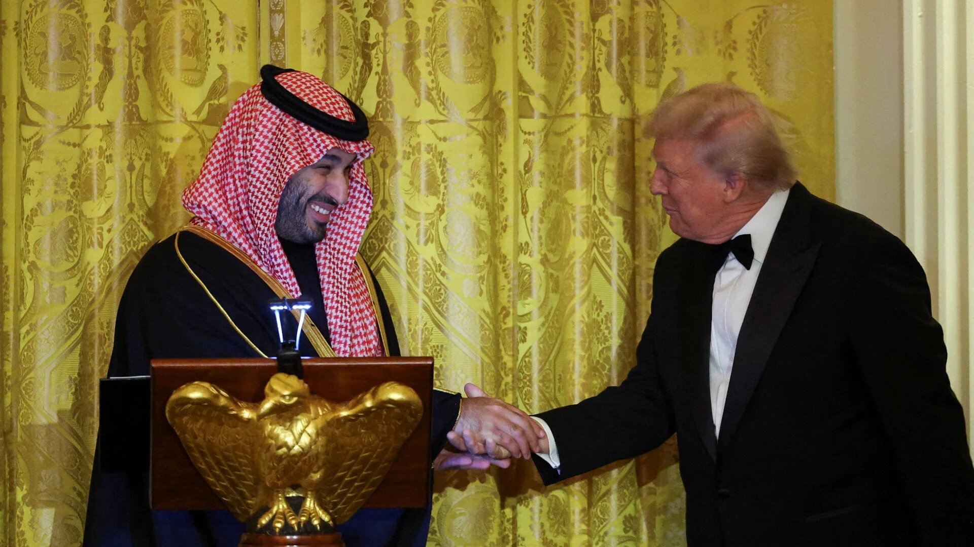 US President Donald Trump greets Saudi Crown Prince Mohammed bin Salman during a dinner at the White House in Washington on 18 November 2025 (Reuters)