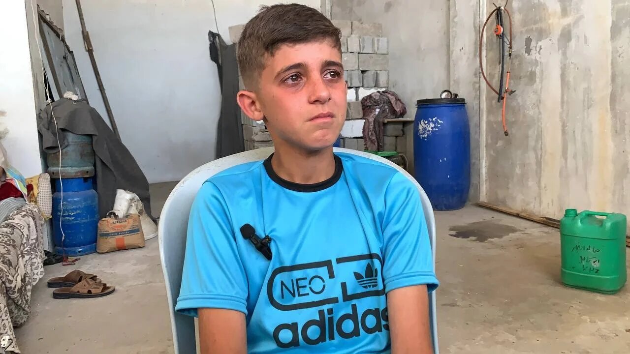13 year-old Mohammad Ahmad Kamel Sarhan, who was taken with his mother by Israeli forces during a special operation in Khan Younis, sobs as he recalls abuse under Israeli captivity (MEE/Ahmed Aziz)