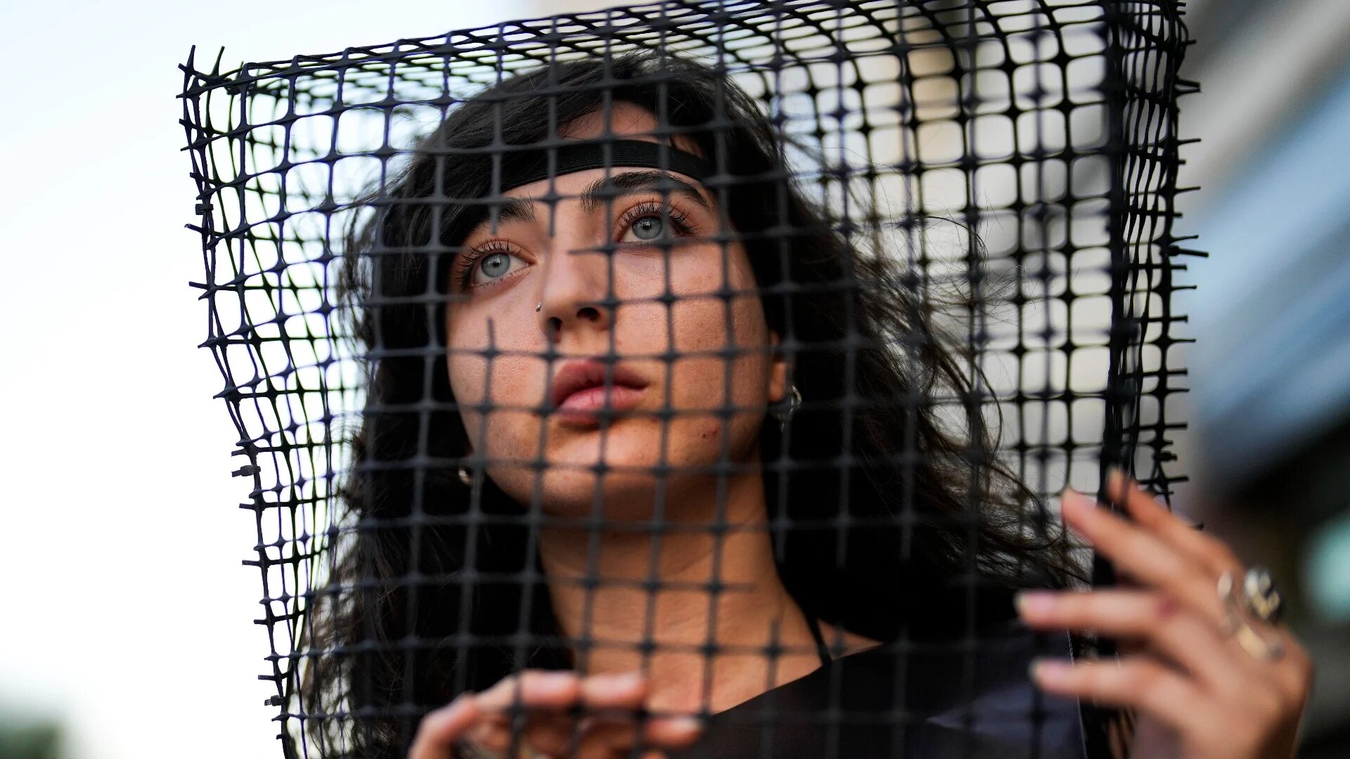 A woman looks on during a protest asking for the release of Israeli and German people held by Hamas in Gaza, in Tel Aviv, 25 October (AP)