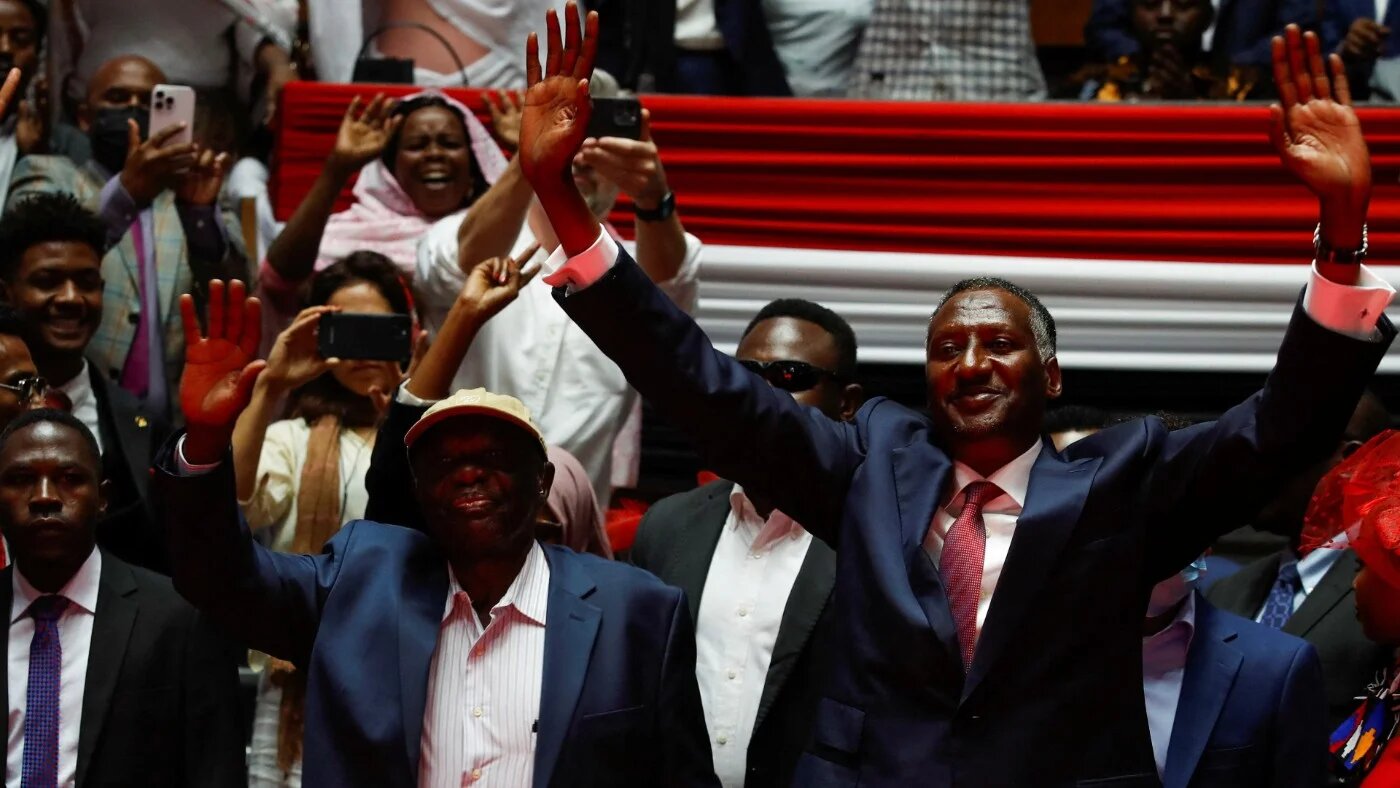 Deputy leader of Sudan's RSF Abdul Rahim Hamdan Dagalo, right, and the leader of Sudan's People's Liberation Movement North Abdelaziz Al-Hilu, centre, in Nairobi, Kenya, 18 February 2025 (Monicah Mwangi/Reuters)