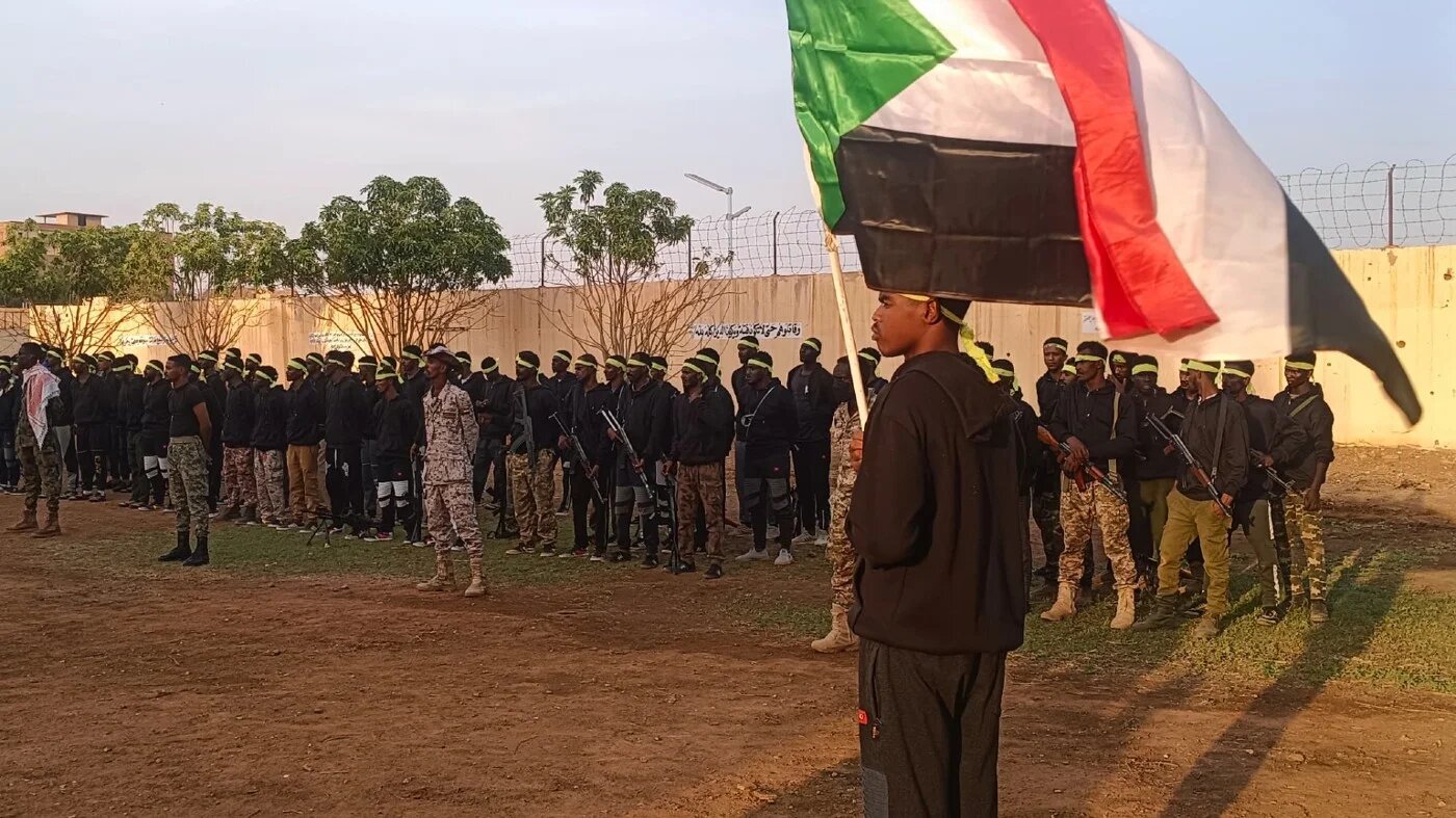 Fighters from al-Bara ibn Malik brigade at a training camp run by the Sudanese Armed Forces (Mohammed Amin/MEE)