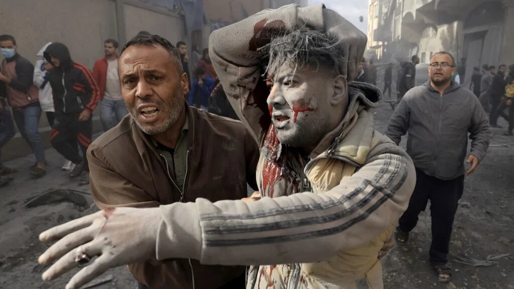 An injured Palestinian man gestures after an Israeli strike on Rafah in the southern Gaza Strip on 20 November 2023 (AFP)