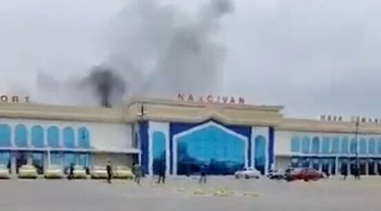 Smoke from an apparent drone strike seen rising over Azerbaijan's Nakhchivan airport in a screenshot taken from mobile phone footage (social media)