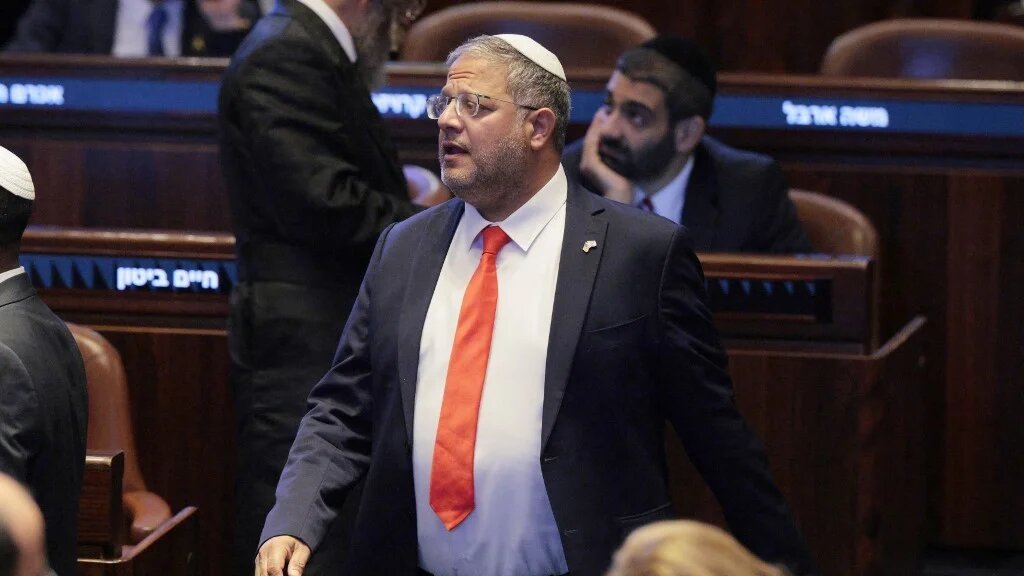 Israel's National Security Minister Itamar Ben Gvir stands at the Israeli parliament, the Knesset, ahead of an address by the US president in Jerusalem on 13 October 2025 (AFP)