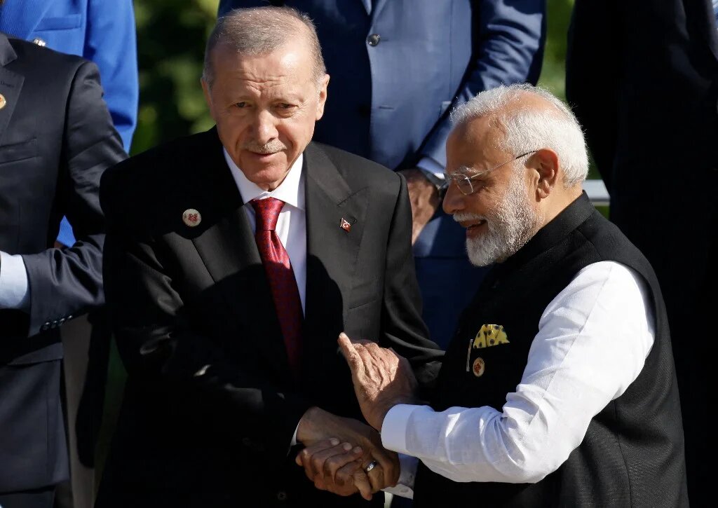 Turkish President Recep Tayyip Erdogan (left) and Indian Prime Minister Narendra Modi (right) pictured after the first session of the G20 Leaders' Summit in Rio de Janeiro, Brazil, on 18 November 2024 (Ludovic Marin/AFP)