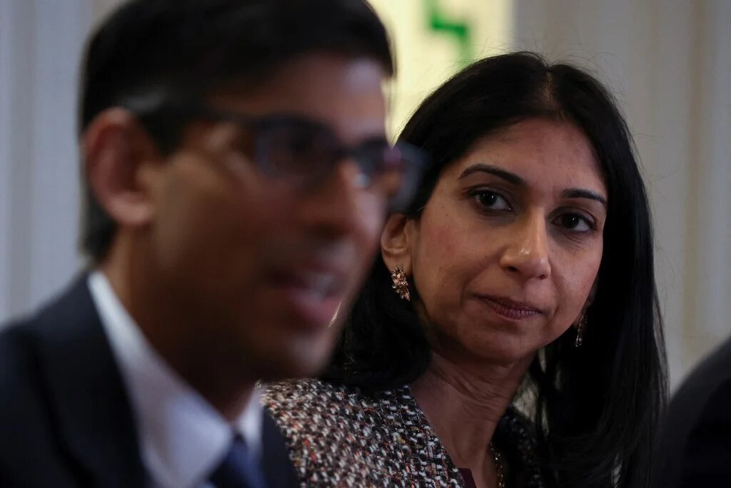 Britain's Prime Minister Rishi Sunak (L) and Home Secretary Suella Braverman announce a new police task force to help tackle grooming gangs, in Rochdale, 3 April 2023 (AFP)