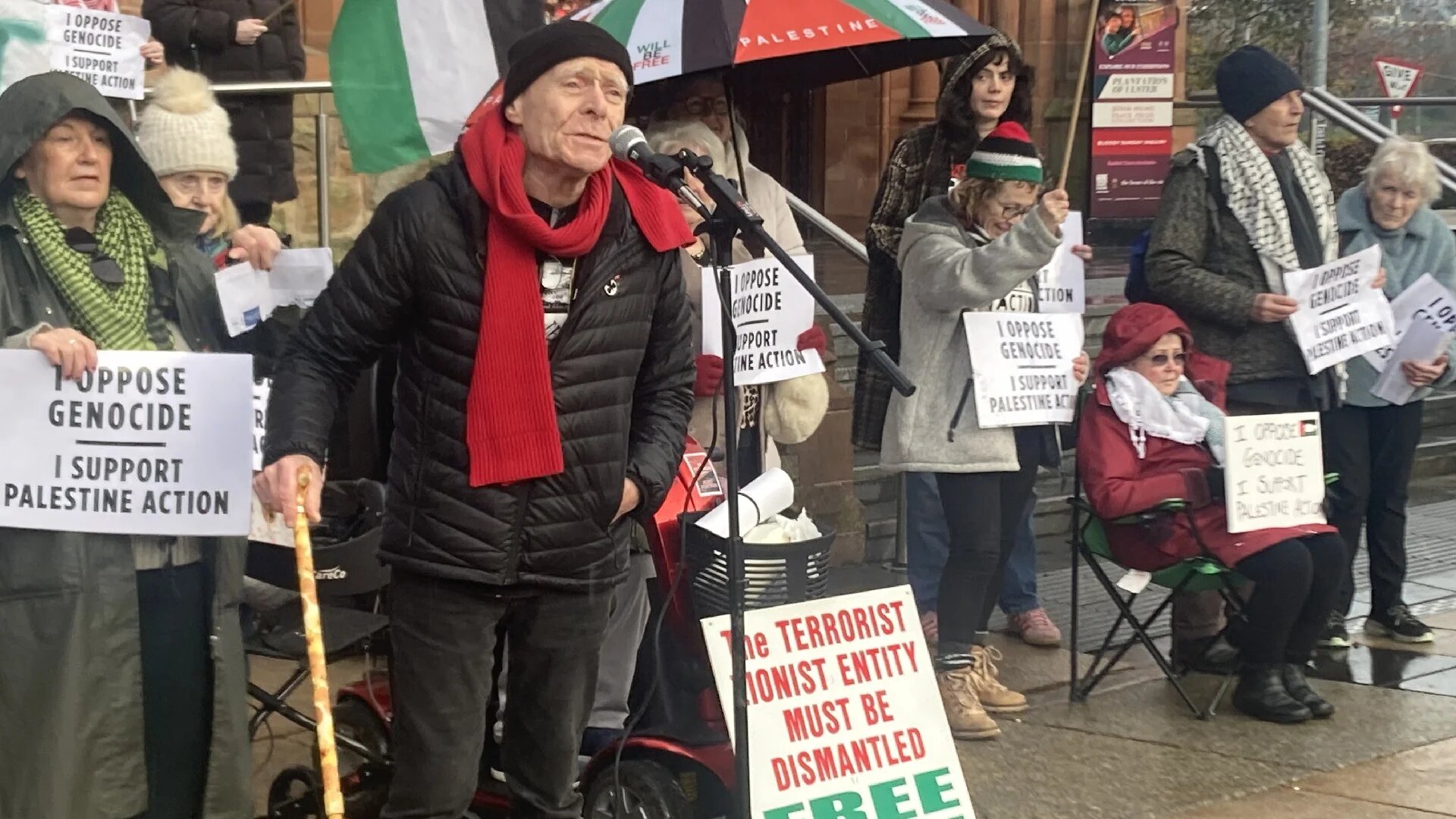 Civil rights activist Eamonn McCan speaks outside the Guildhall at a protest to lift the ban on Palestine Action in Derry, Northern Ireland on 22 November 2025 (MEE/Katherine Hearst)