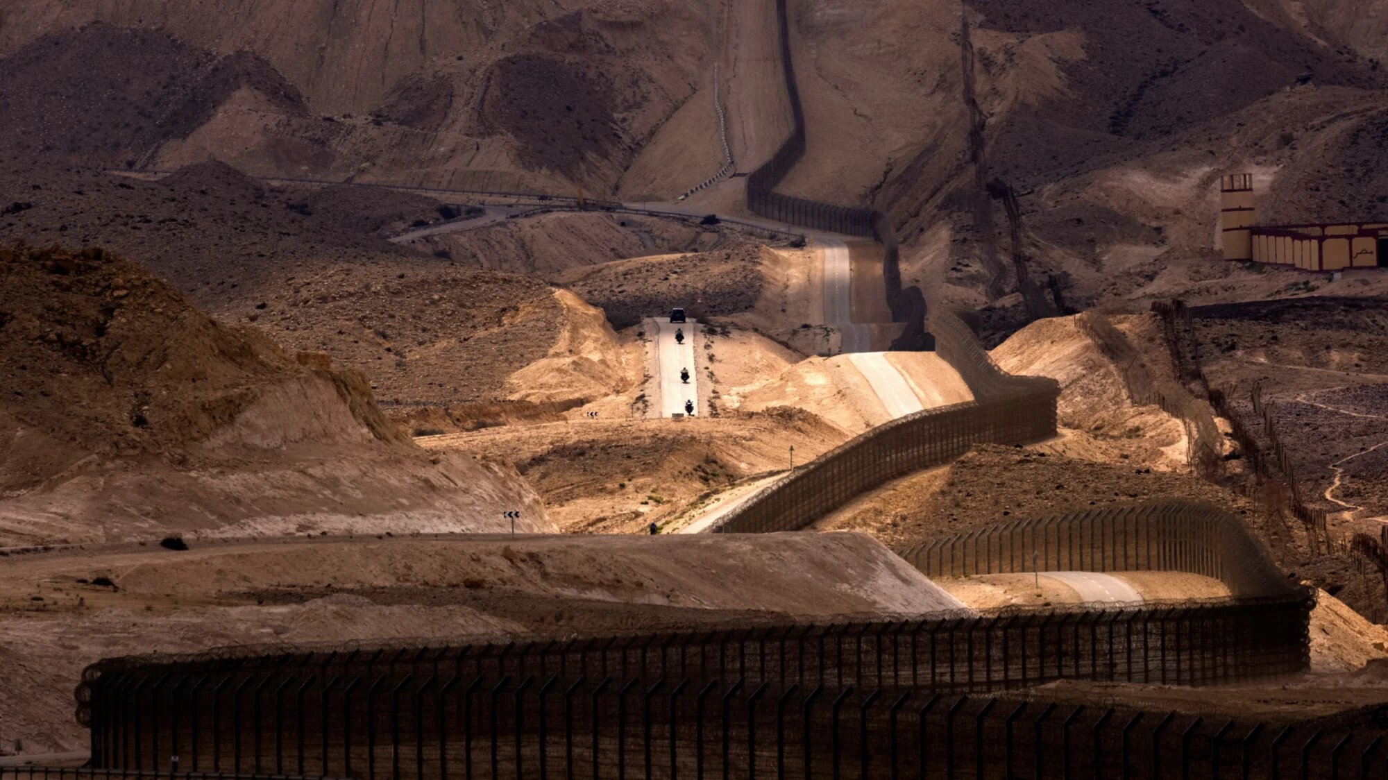 An Egyptian military outpost overlooks the Israel-Egypt border as seen from southern Israel, 27 September 2021 (Reuters)