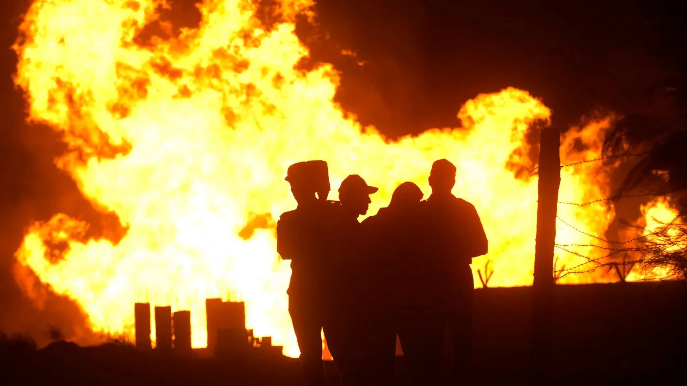 Fire from an attack on an Egyptian pipeline connecting to Israel is seen in July 2011 (Reuters)