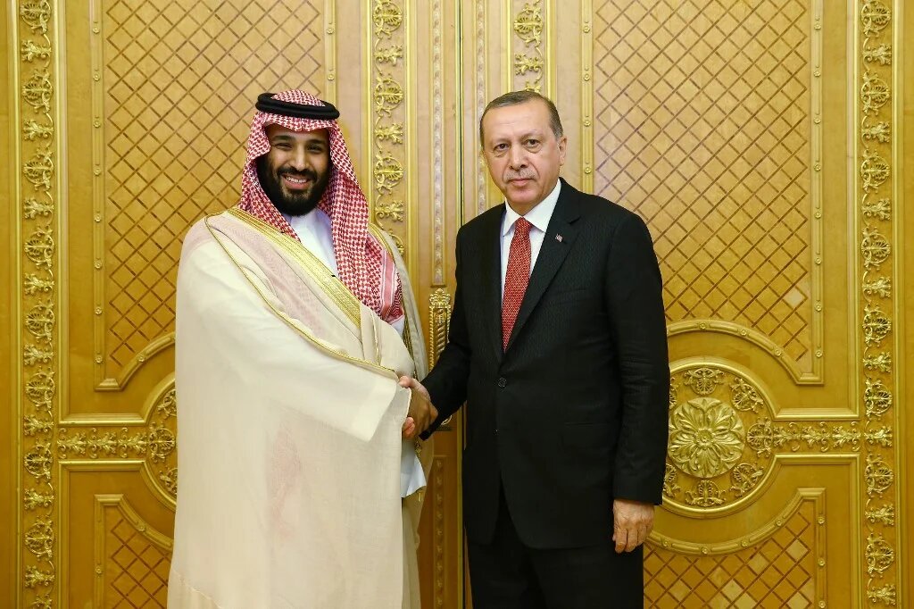 Turkish President Recep Tayyip Erdogan (R) shaking hands with Saudi Crown Prince Mohammed bin Salman (L) during a meeting as part of an official visit in Jeddah, Saudi Arabia.