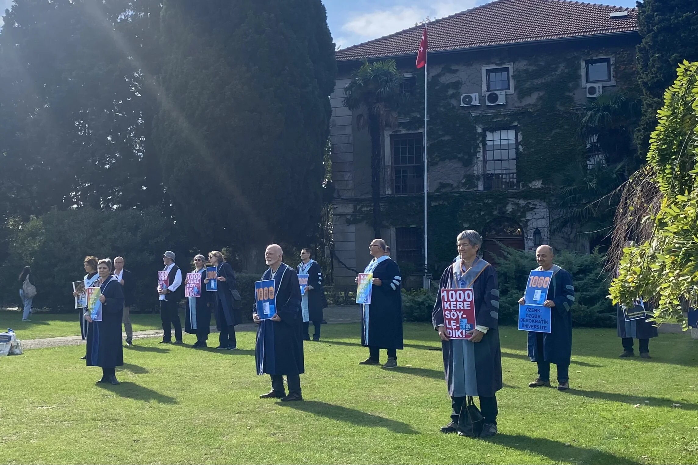 Members of the Bogazici faculty stand in the quadrangle outside the rector's office (Can Candan)