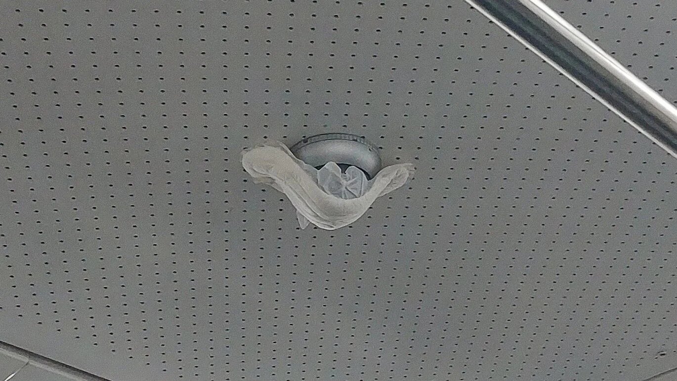 Some sanitary pads coverng security cameras are accompanied by the names of Iranian political dissidents (Twitter/@ShukriyaBradost)