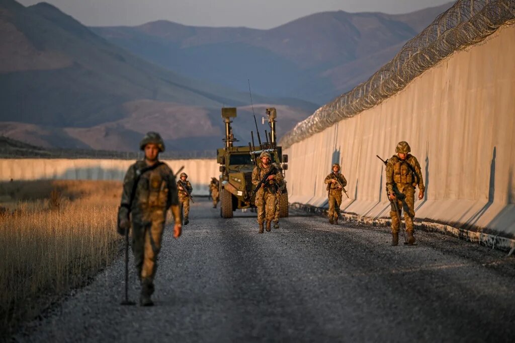 Turkish soldiers patrol near the border wall with Iran in the Van Province, eastern Turkey, on 1 November 2024 (Ozan Kose/AFP)