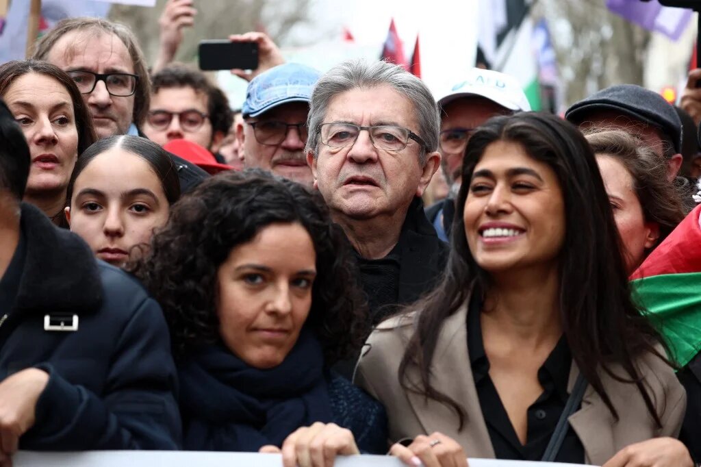 LFI's Jean-Luc Melenchon (center), Rima Hassan (right), and Manon Aubry (left) during a demonstration calling for an immediate ceasefire in Gaza in Paris, 9 March (Emmanuel Dunand/AFP)