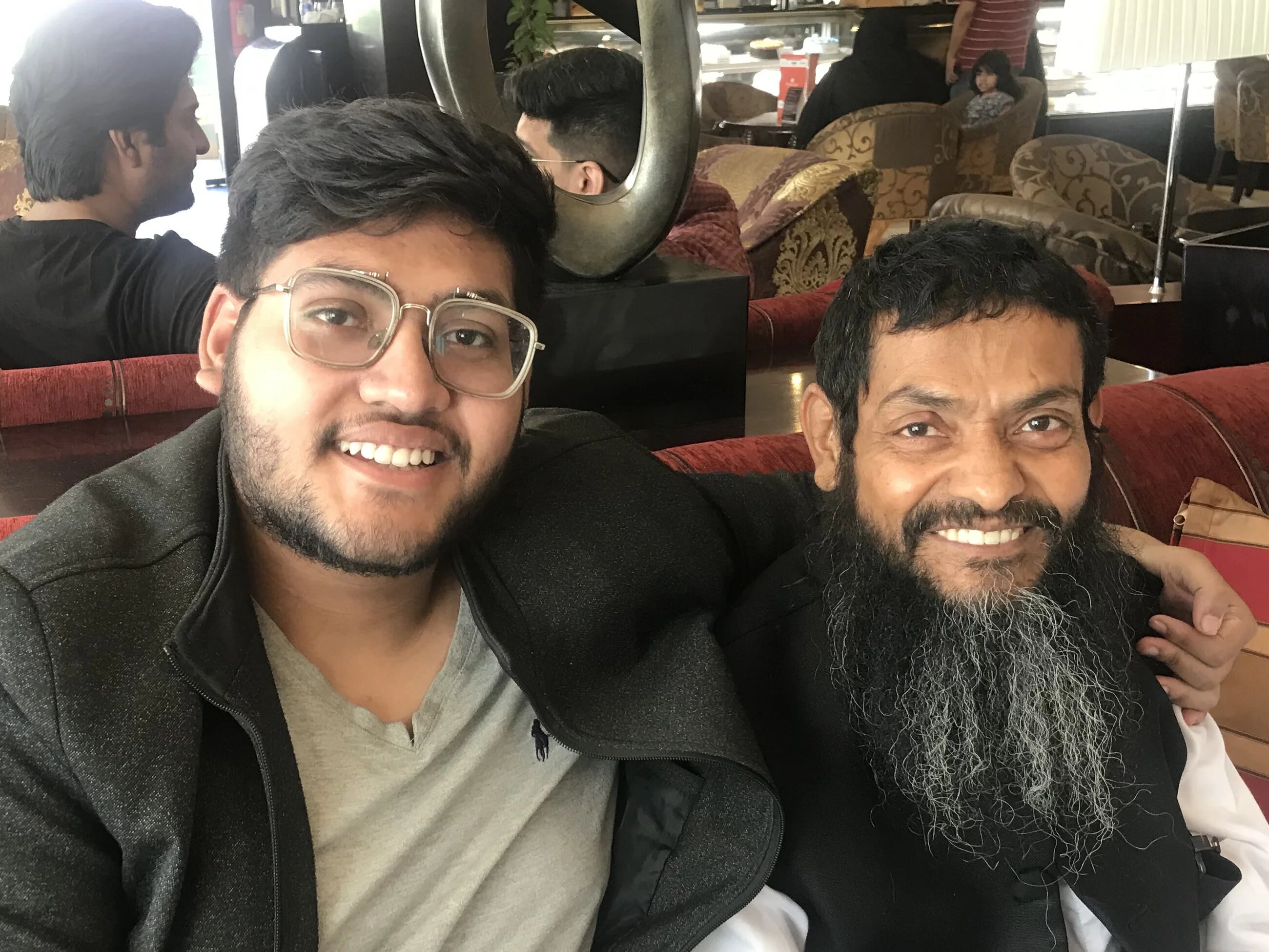 Ahmed Rabbani (R) meets his son, Jawad (L) for the very first time, in Karachi, after spending 20 years in the US's Guantanamo Bay detention facility (Clive Stafford Smith)